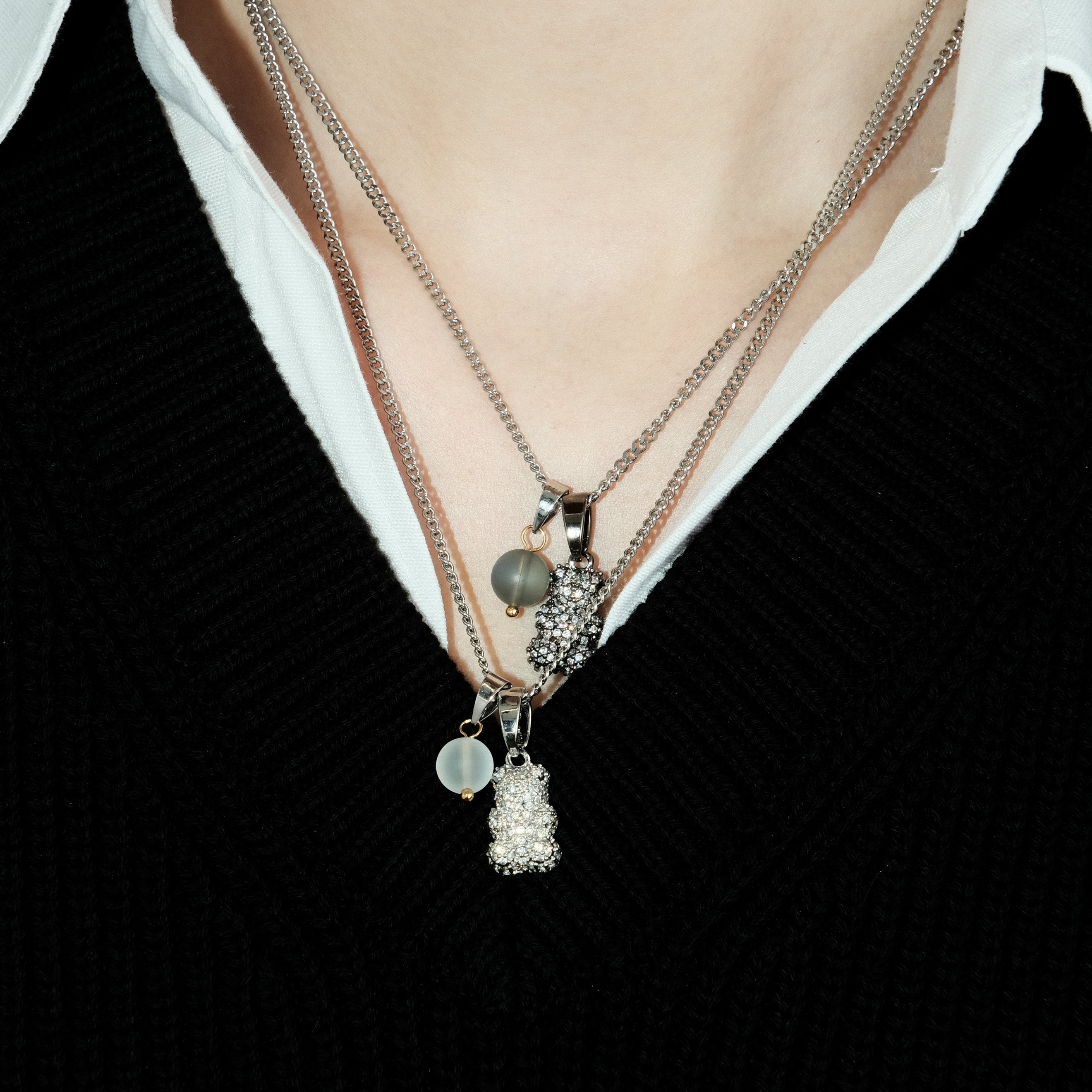 Necklace with silver teddy bear pendant and transparent bead