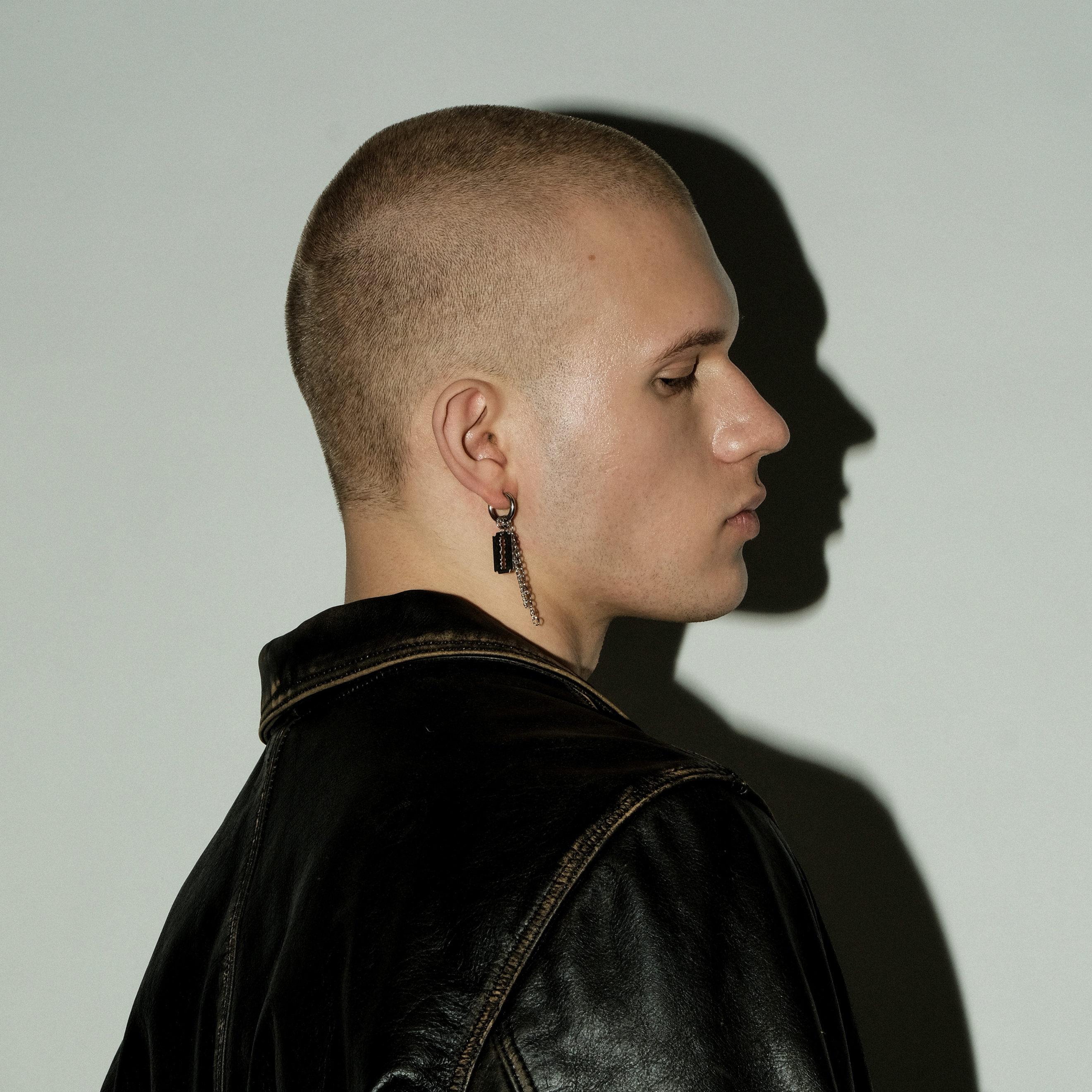 single earring with a blade pendant and chain