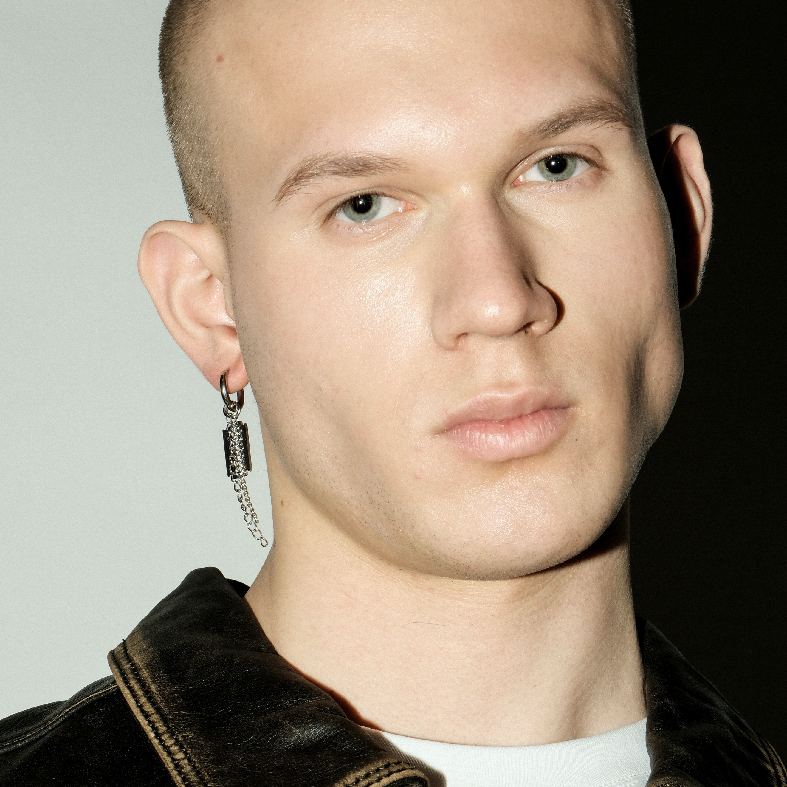 single earring with a blade pendant and chain