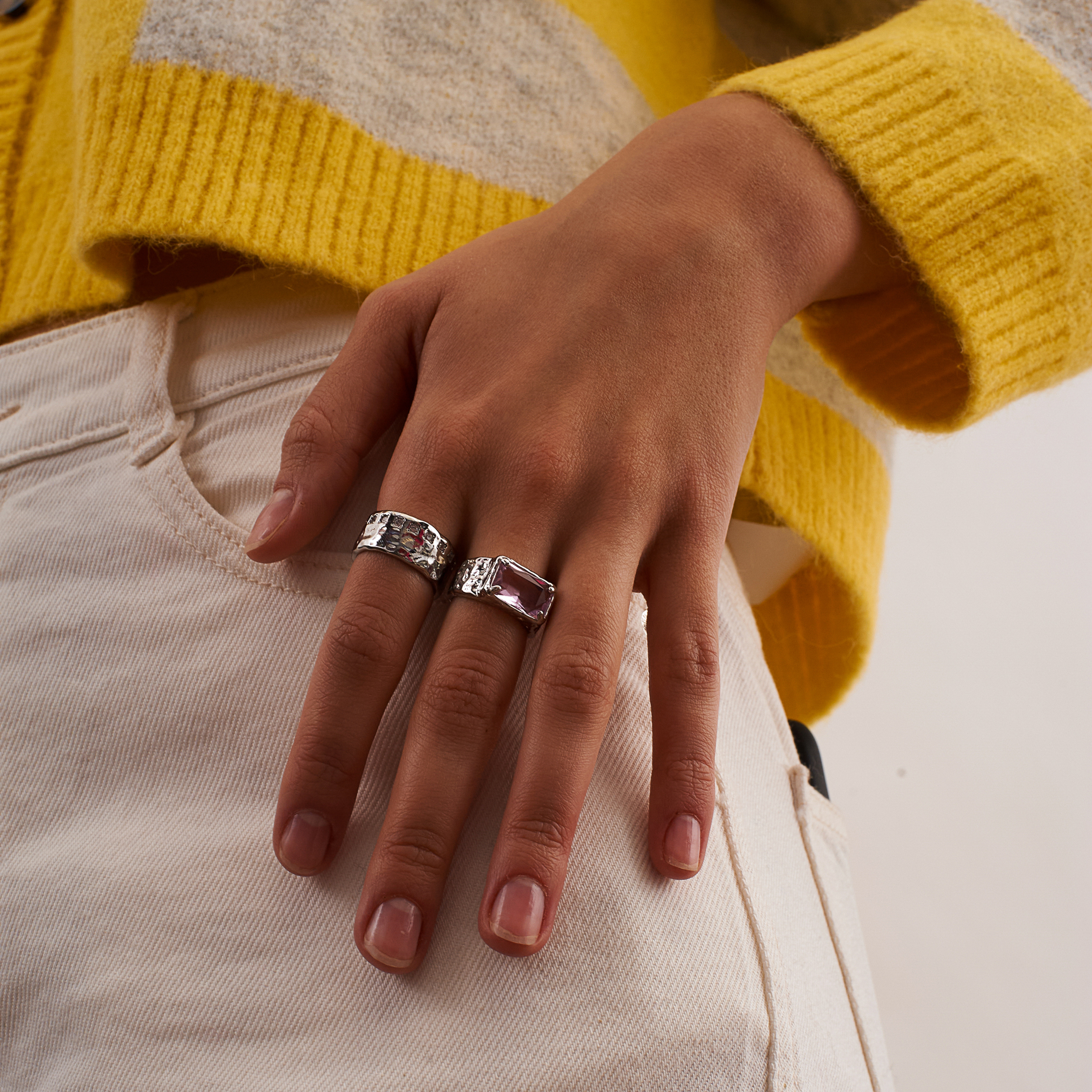 open ring with a large pink crystal baguette