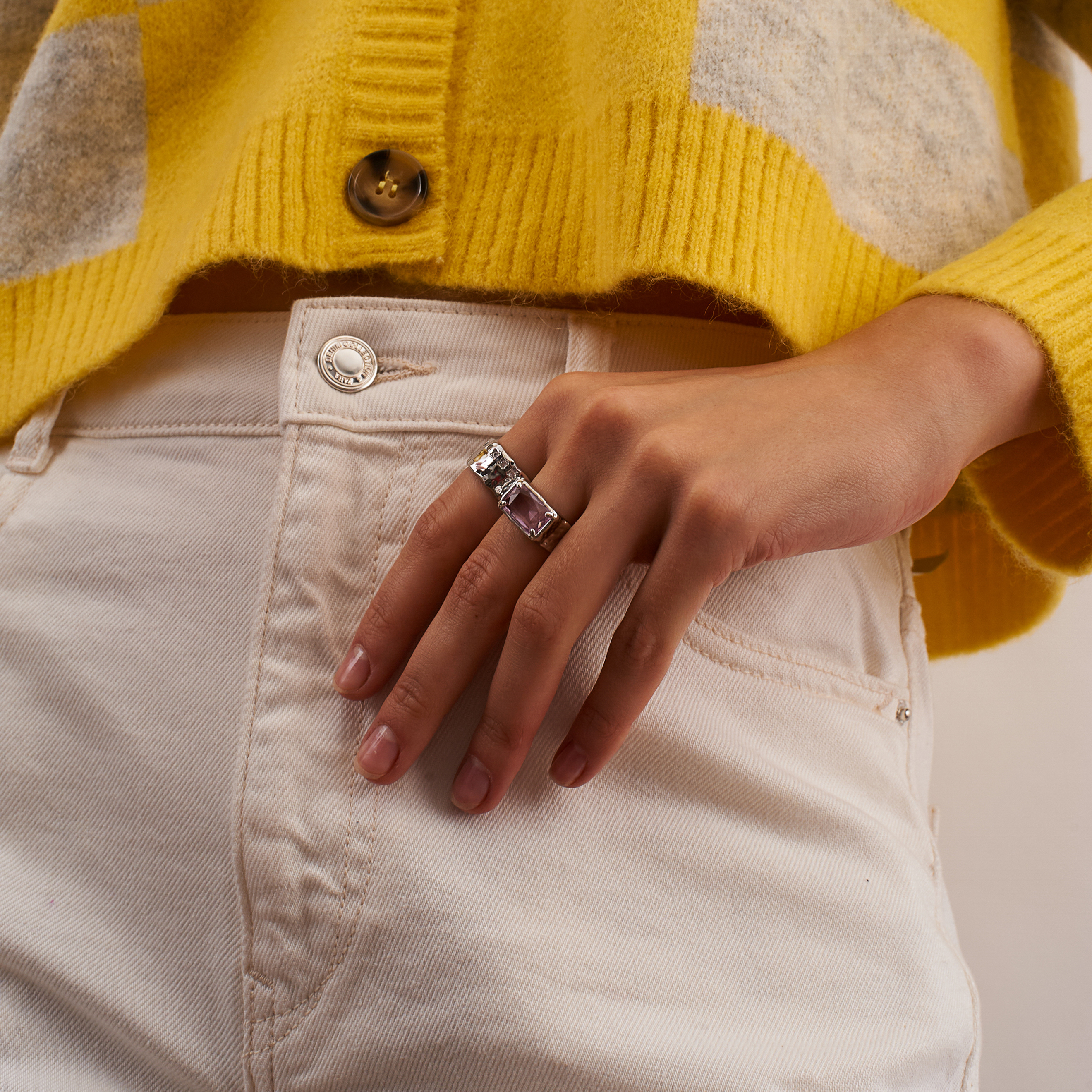 open ring with a large pink crystal baguette