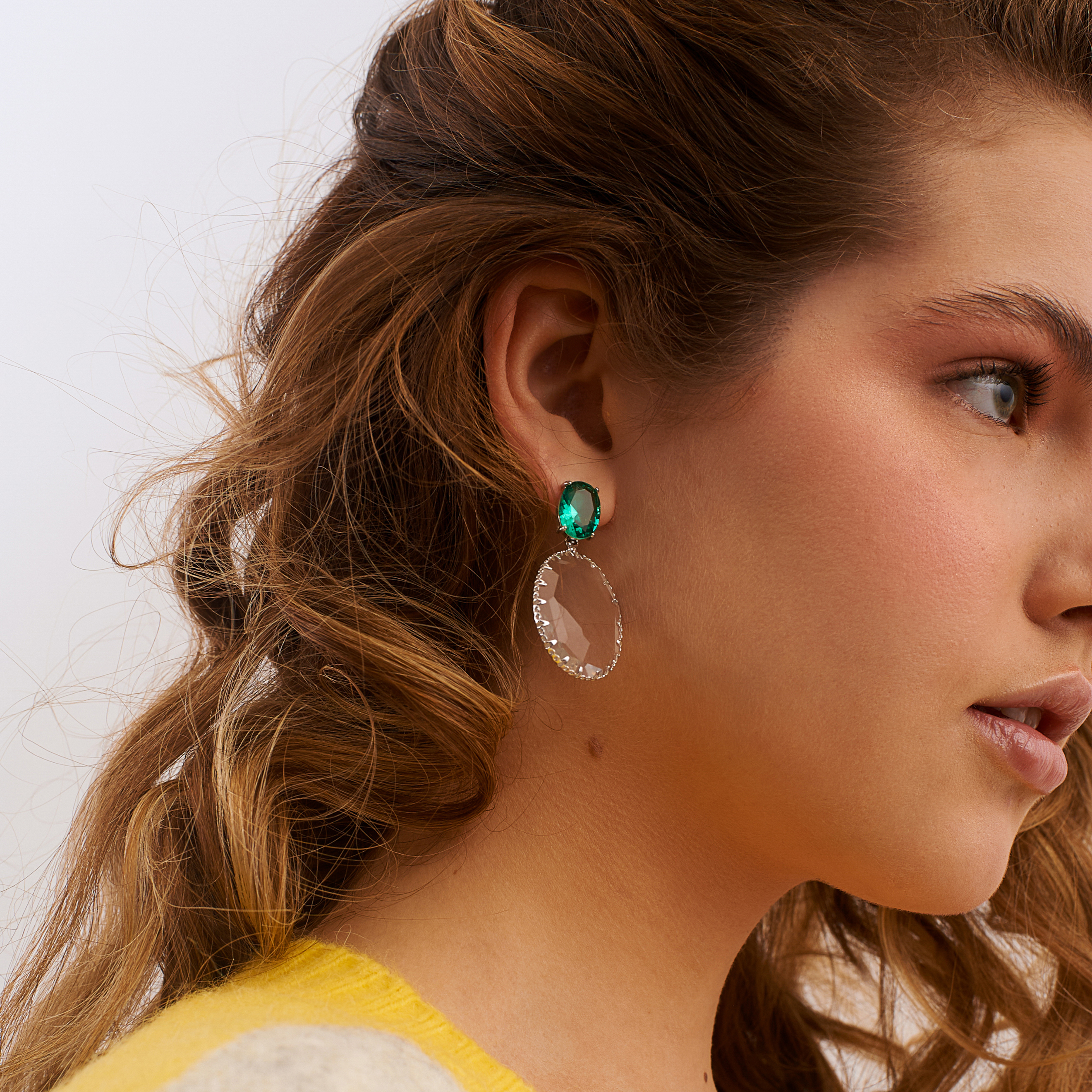 Bicolor earrings with large green crystals and transparent oval pendants