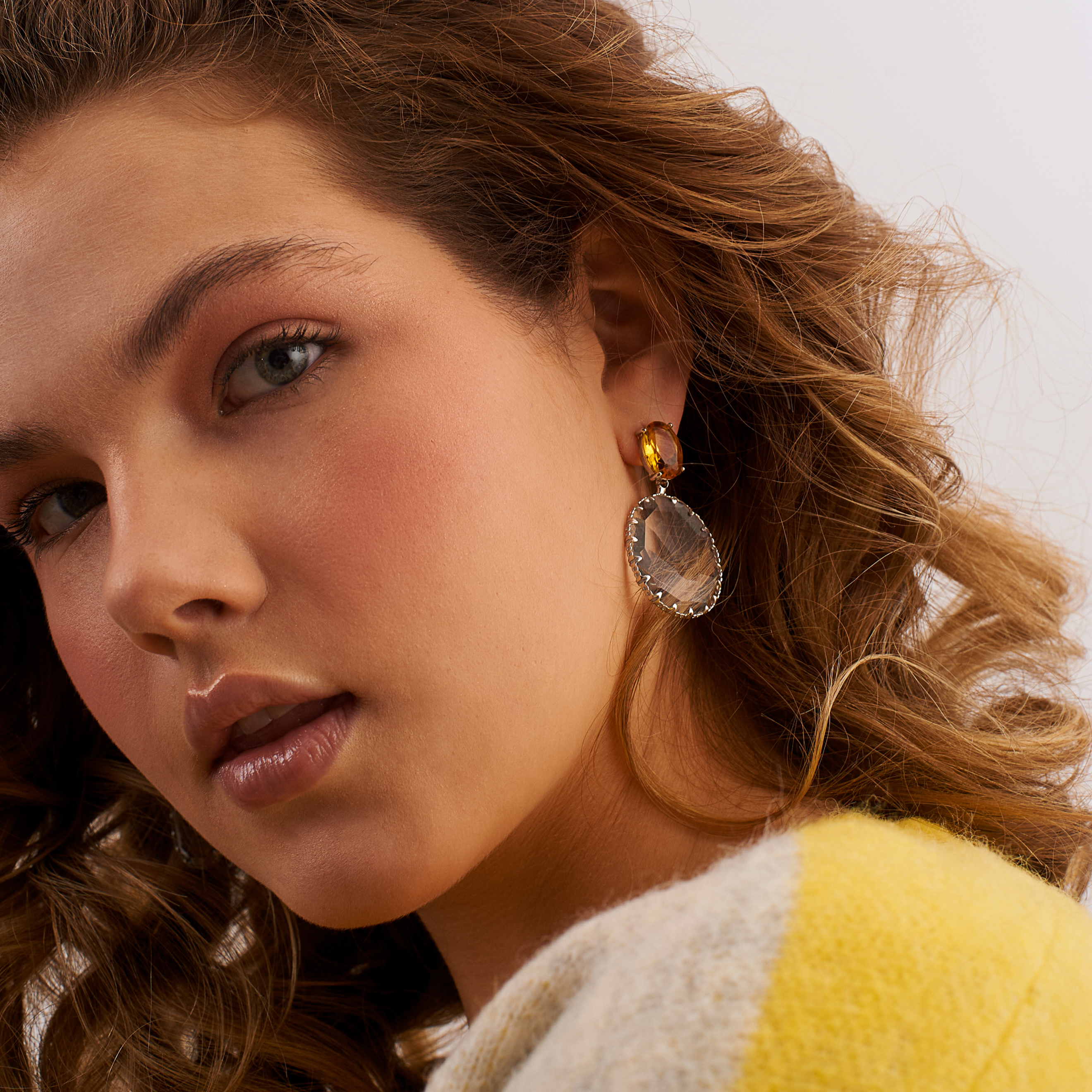 Bicolor earrings with large yellow crystals and transparent oval pendants