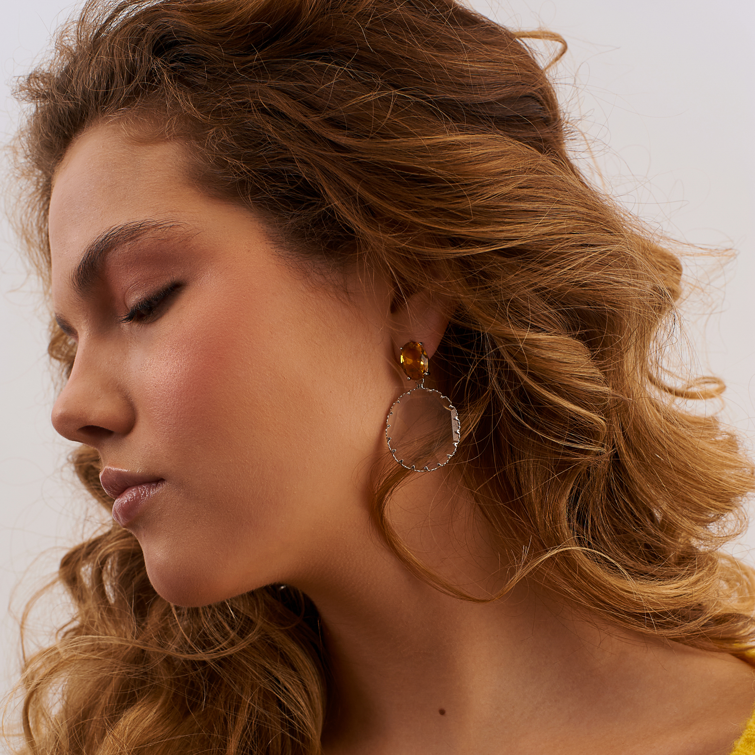 Bicolor earrings with large yellow crystals and transparent oval pendants