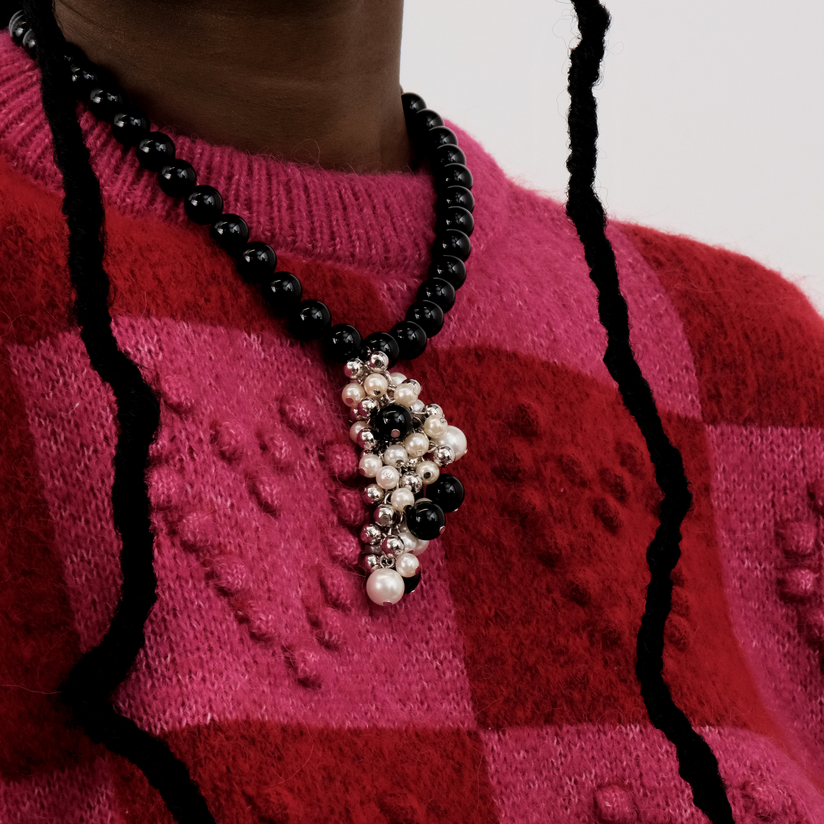 Black beads with a cluster of beads