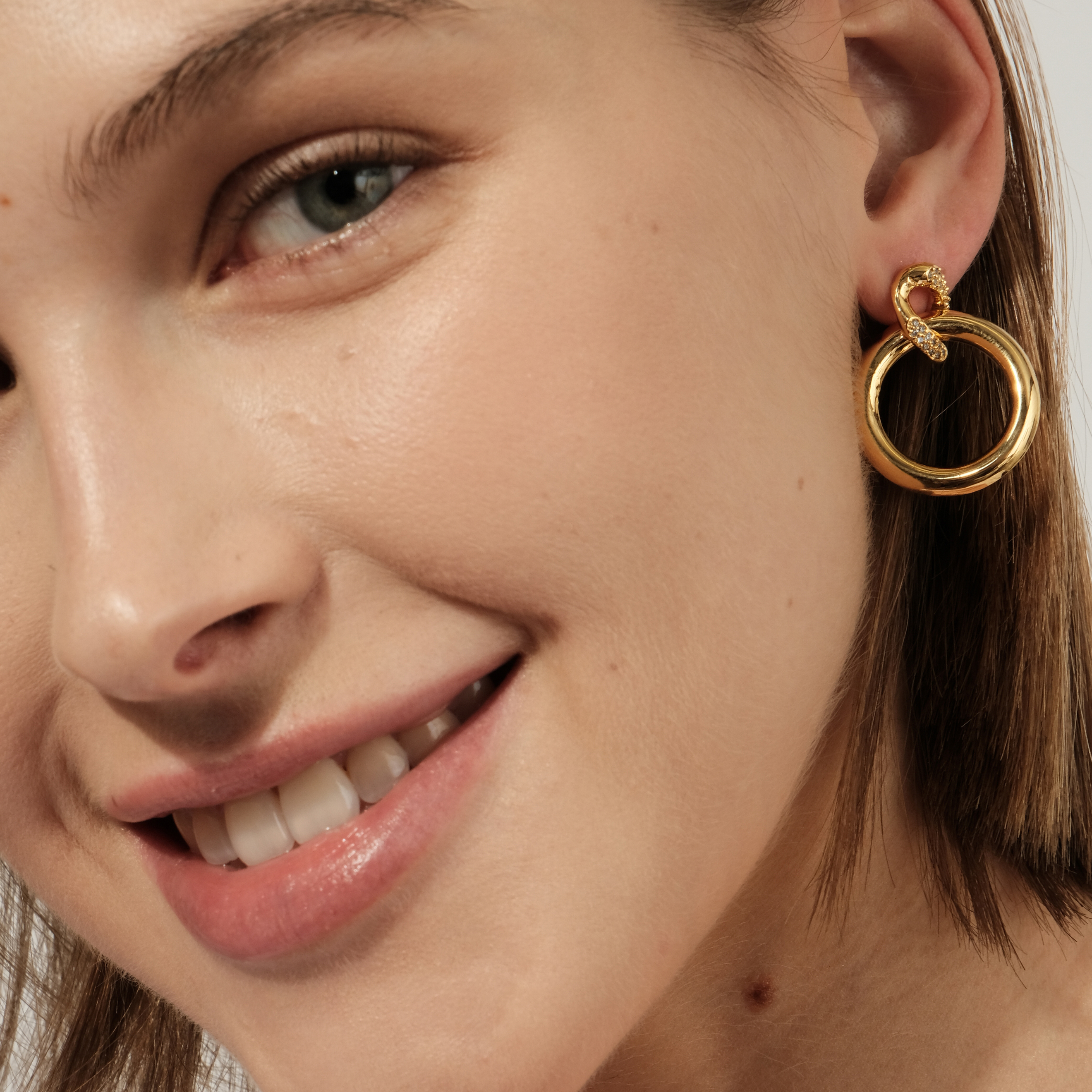 circle earrings with enamel and crystals
