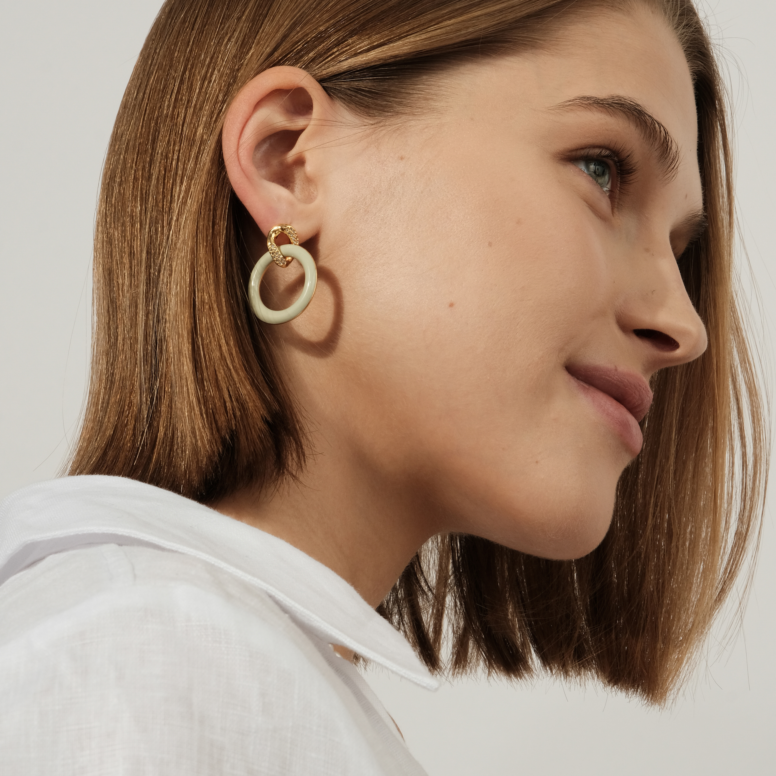 circle earrings with enamel and crystals