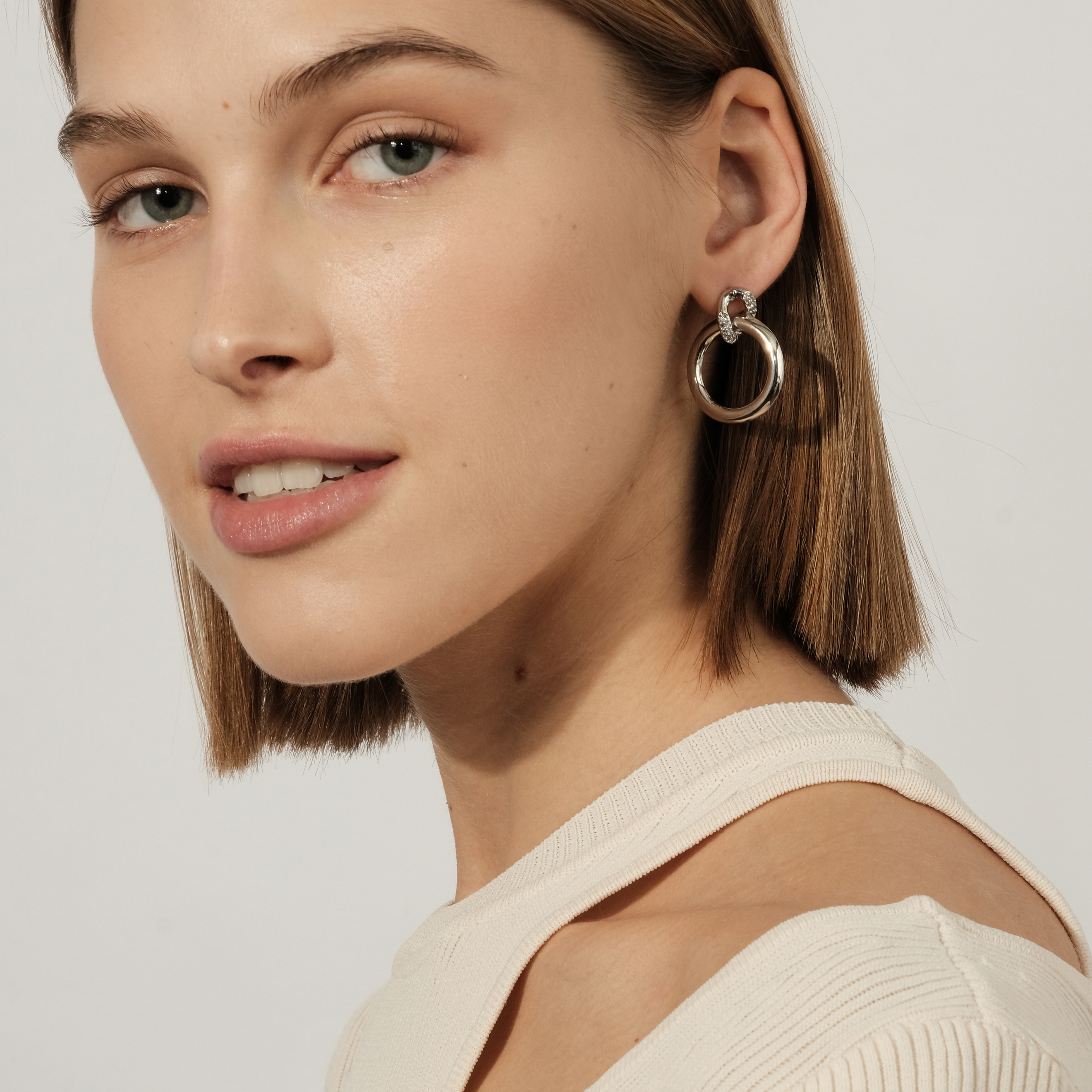 circle earrings with enamel and crystals