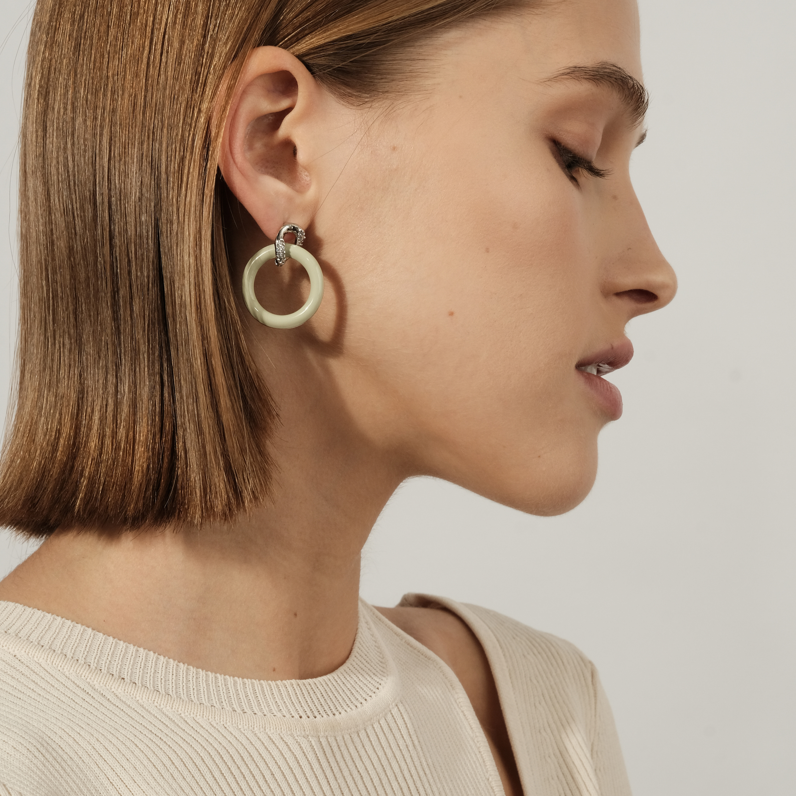circle earrings with enamel and crystals