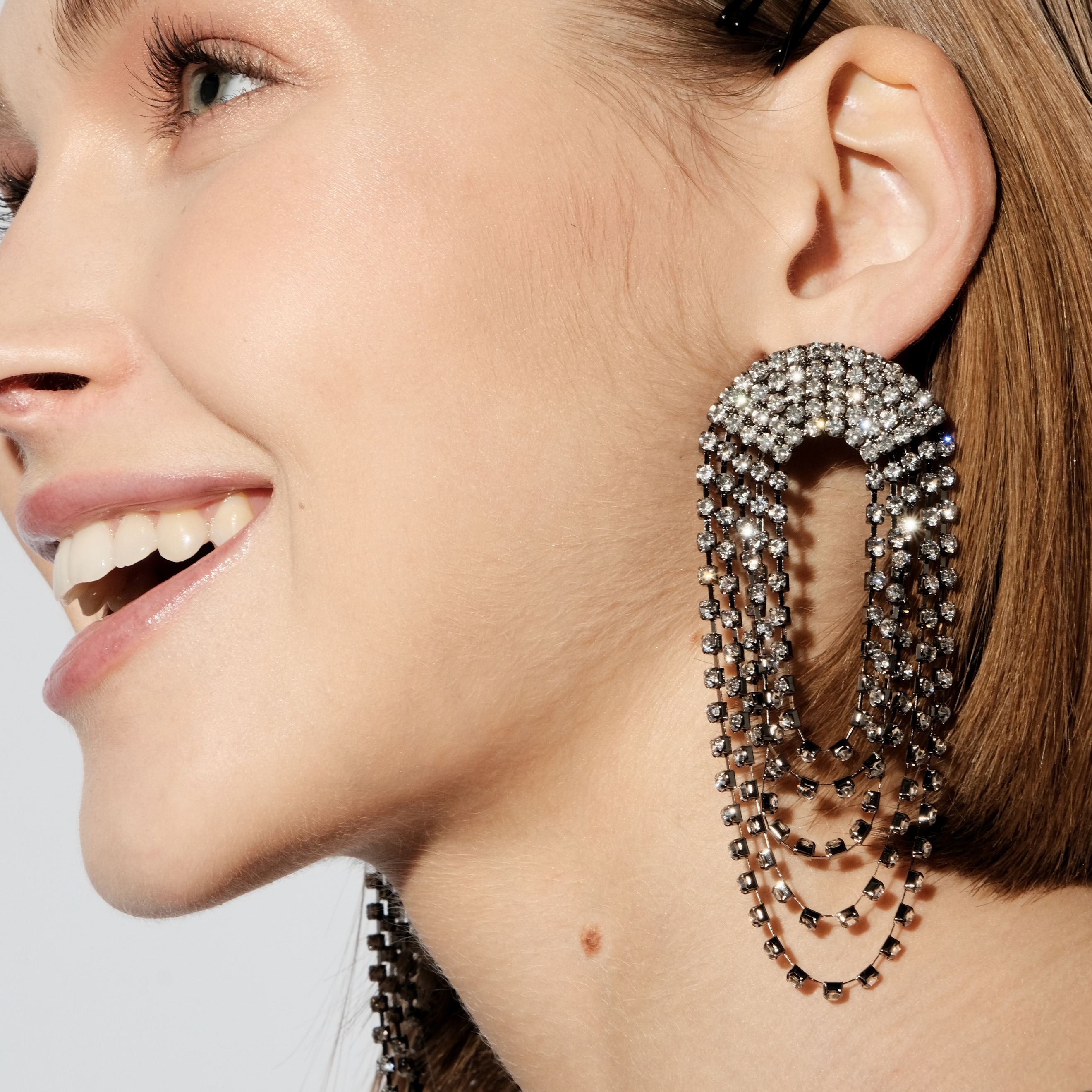 Black oval earrings completely covered with crystals