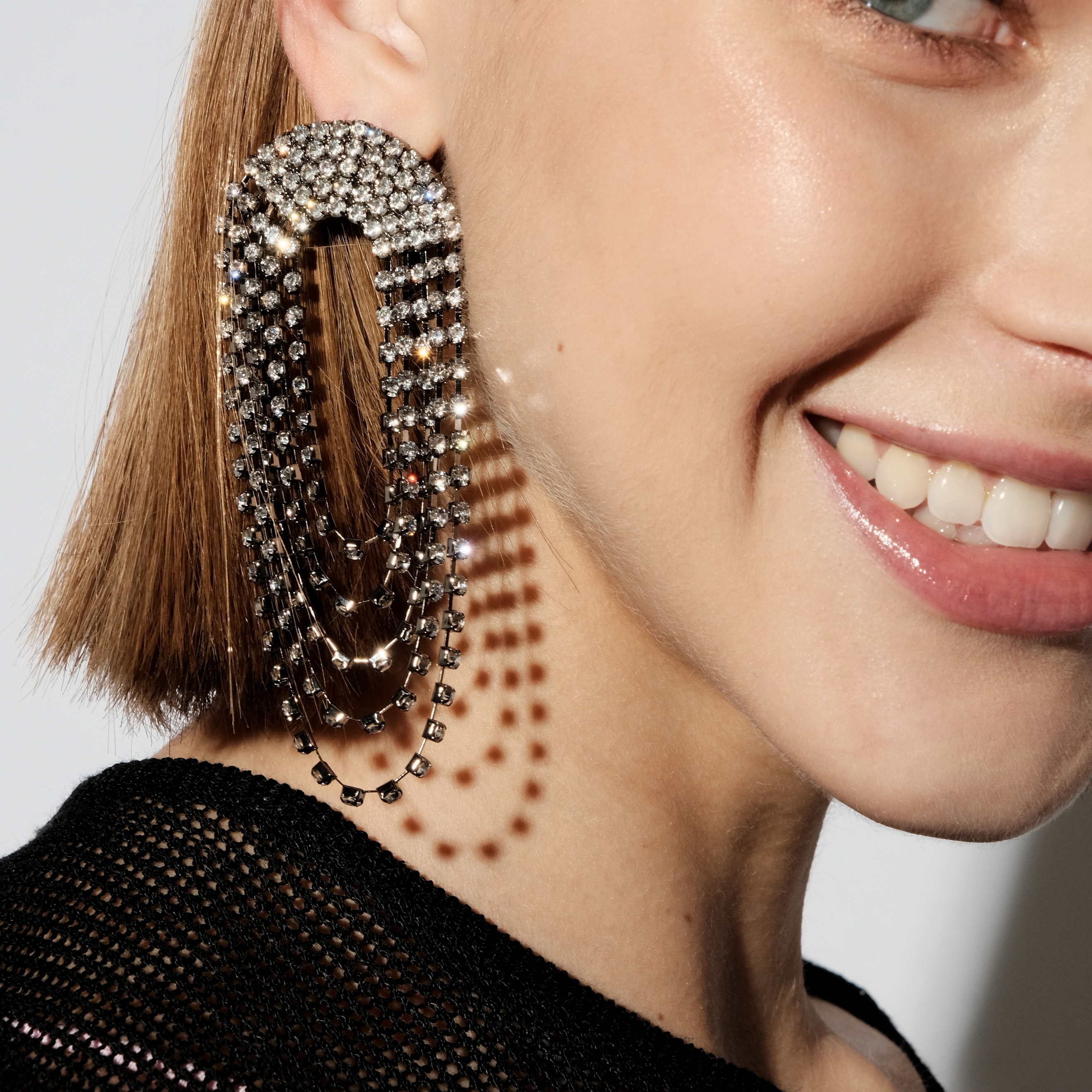 Black oval earrings completely covered with crystals