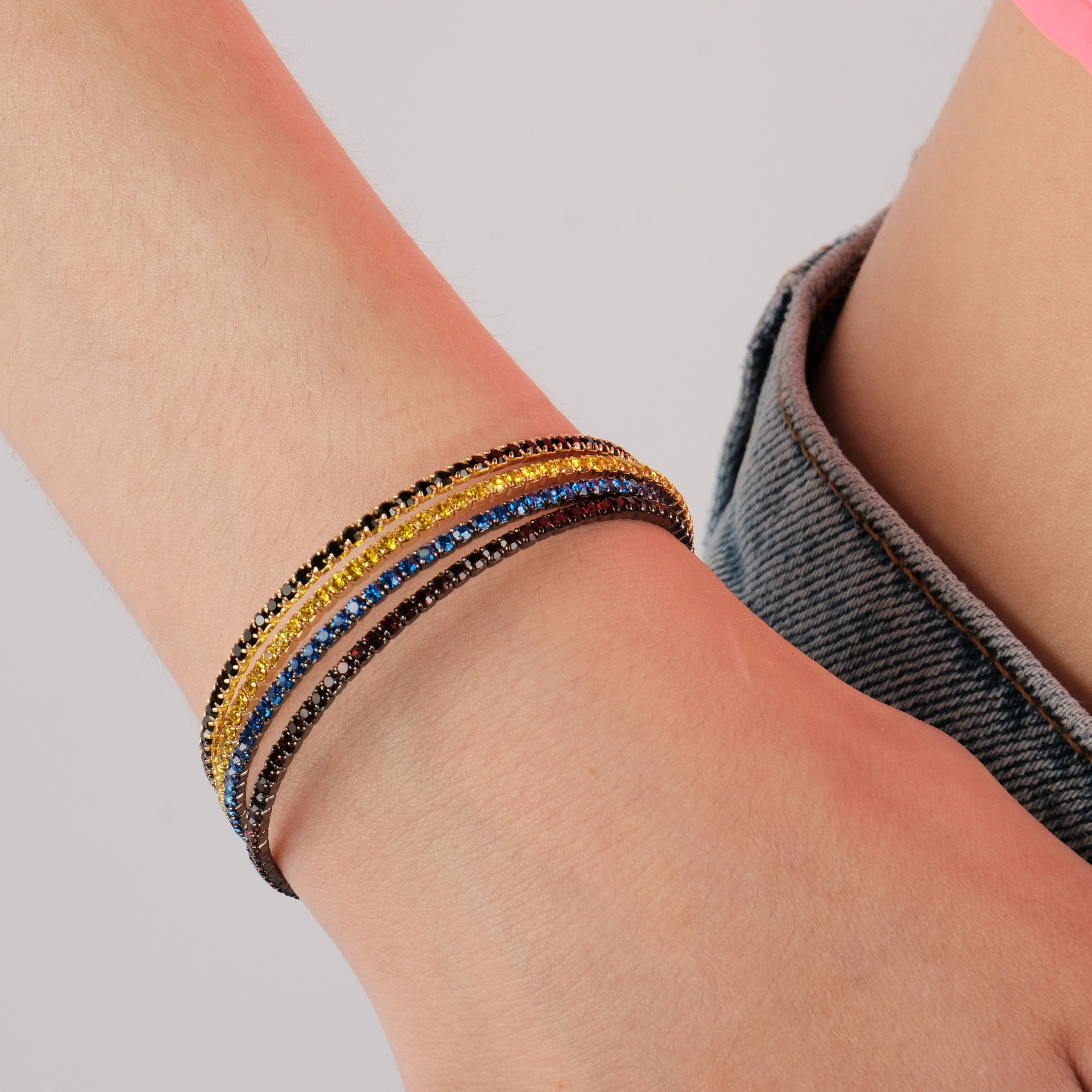 Black bracelet with blue crystals
