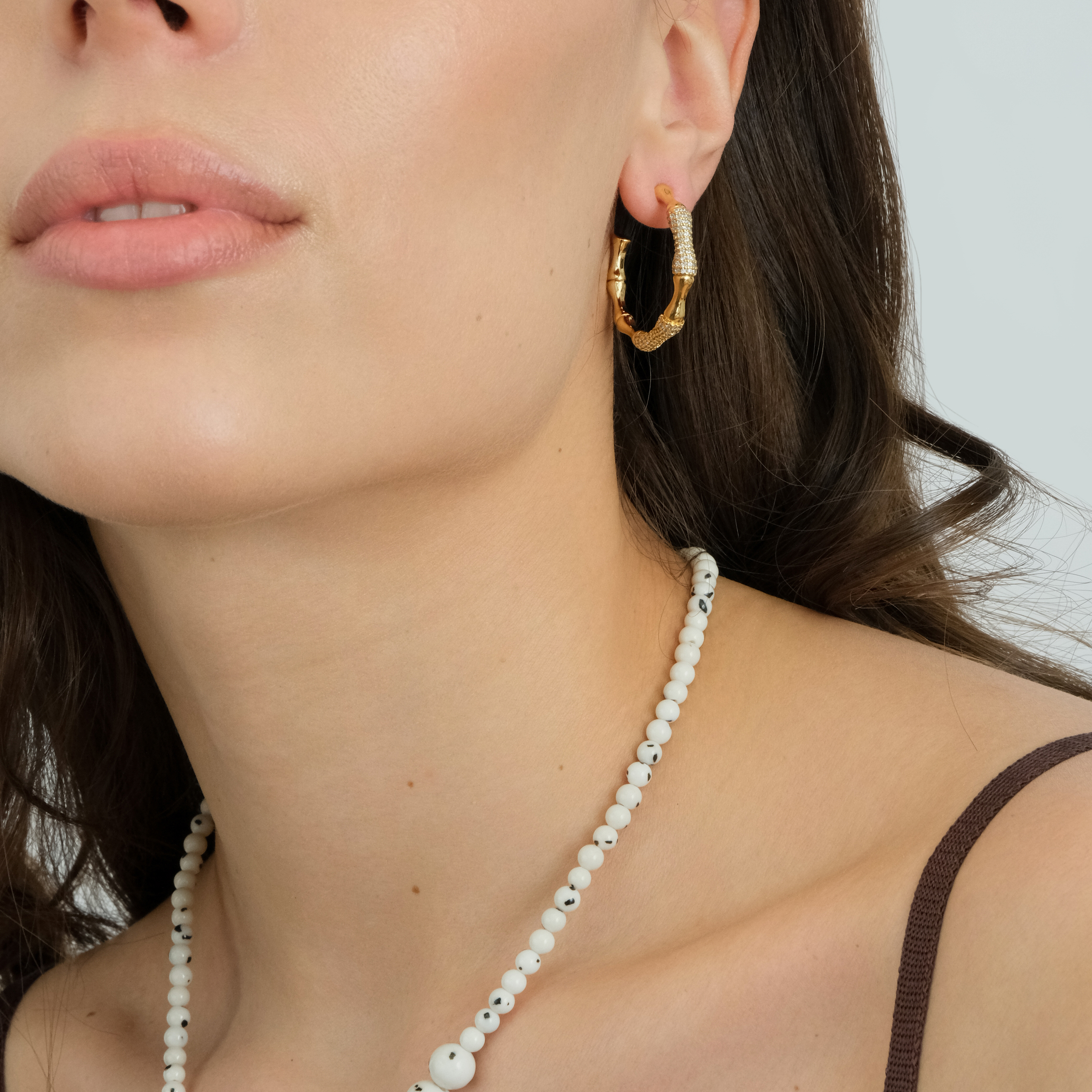 White necklace made of beads of different sizes