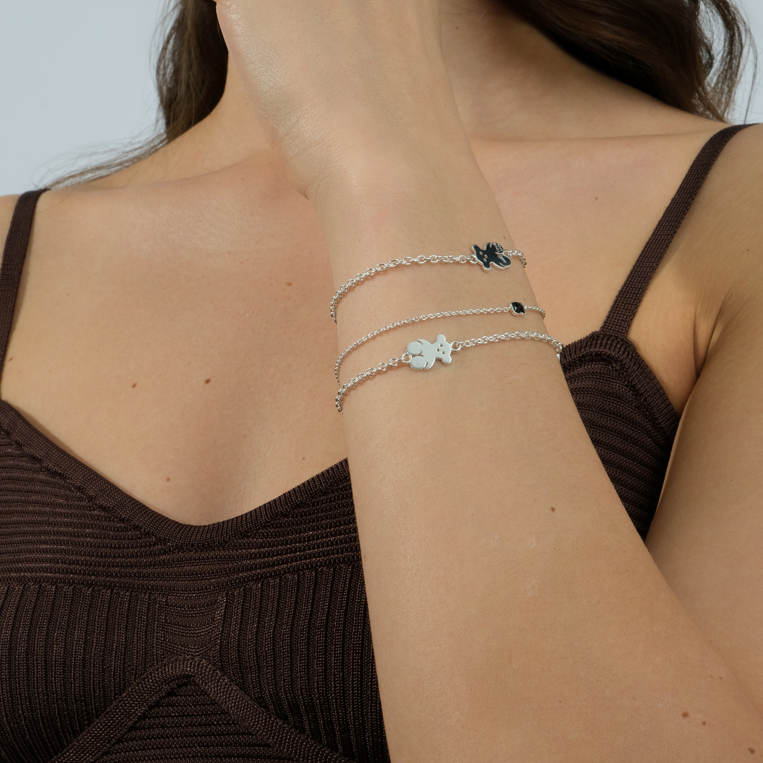 Silver bracelet with a teddy bear and an oval