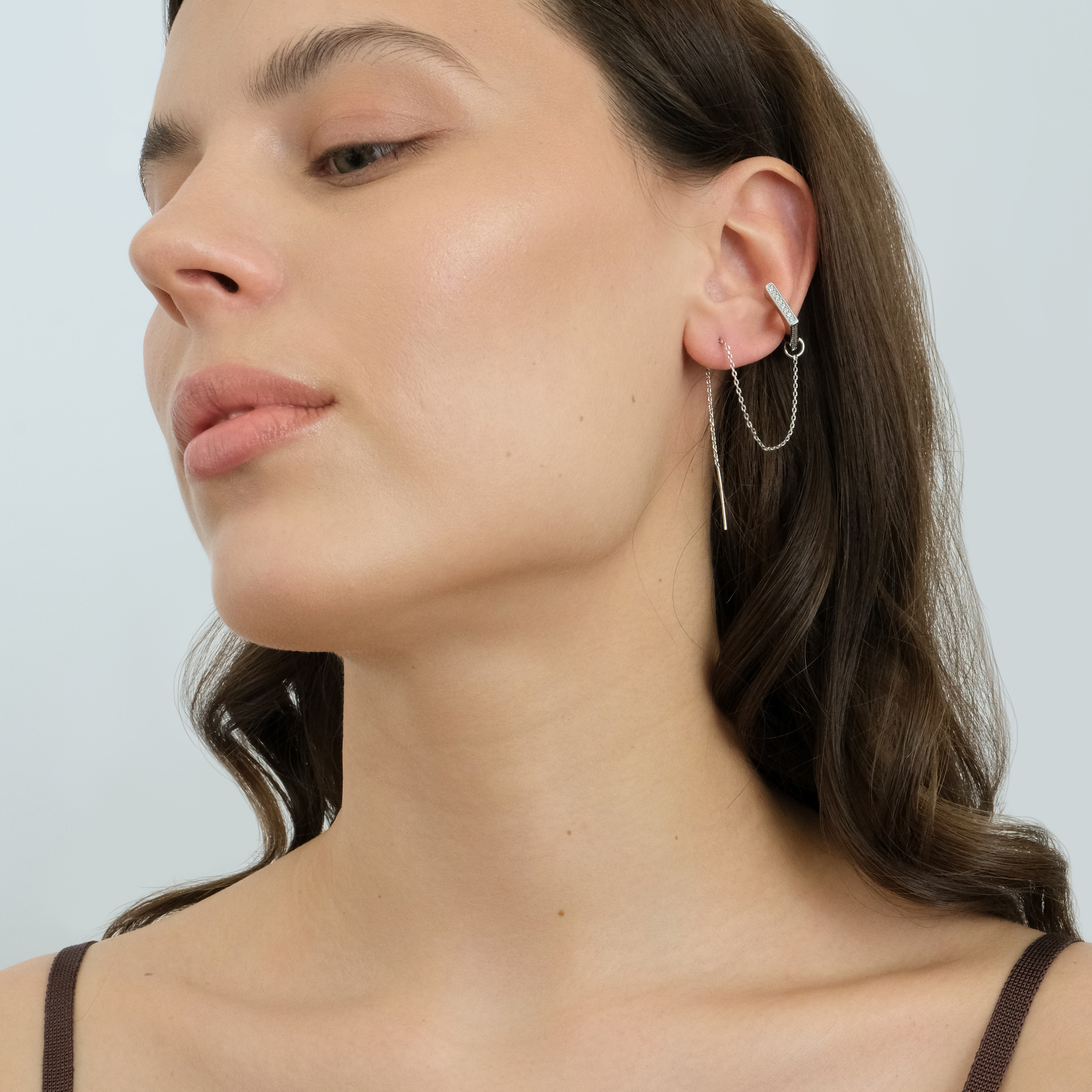 A long silver monoserge with a square cuff with a pavé of crystals