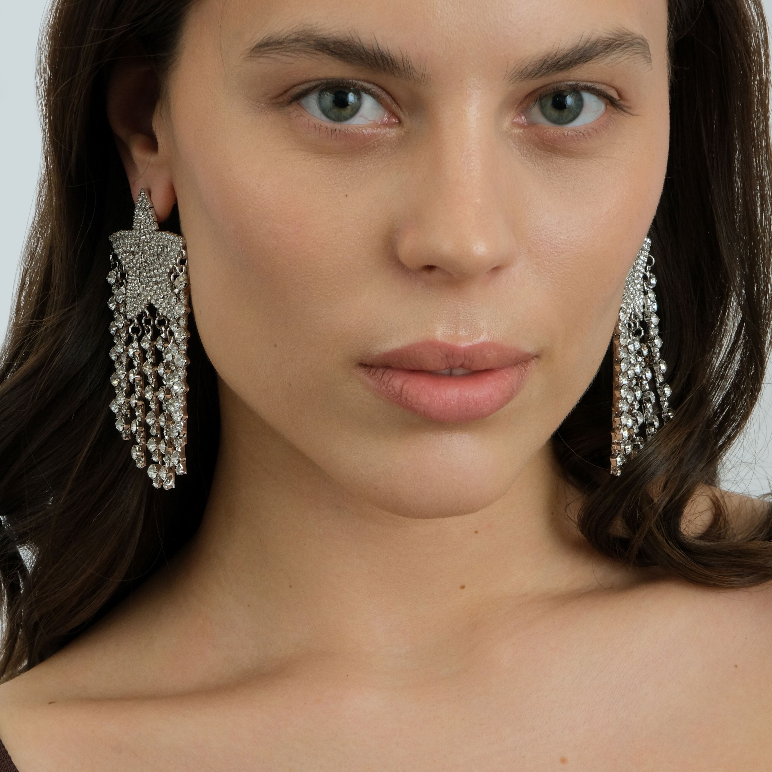 Large  star earrings, completelcovered with crystals, with thread pendants