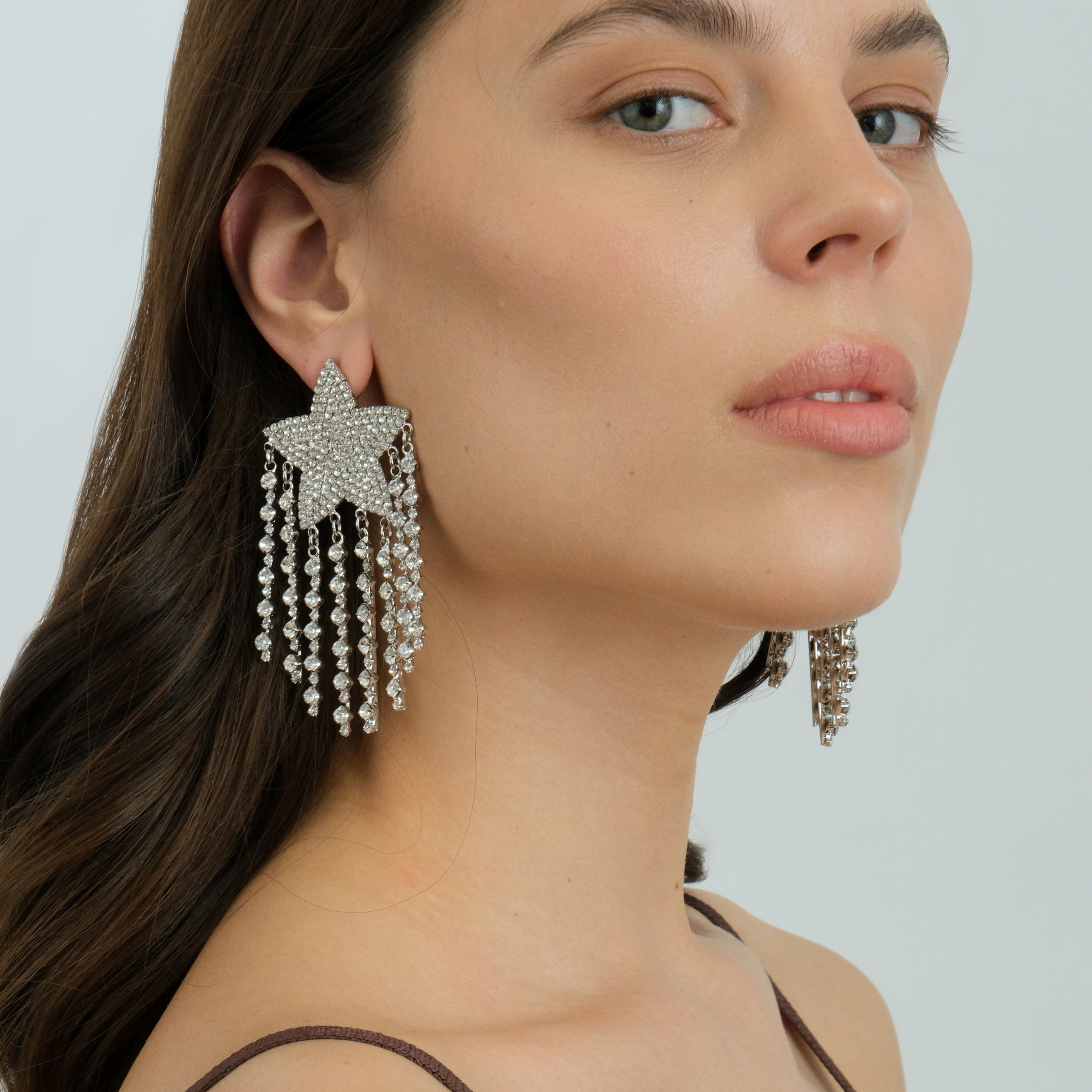 Large  star earrings, completelcovered with crystals, with thread pendants