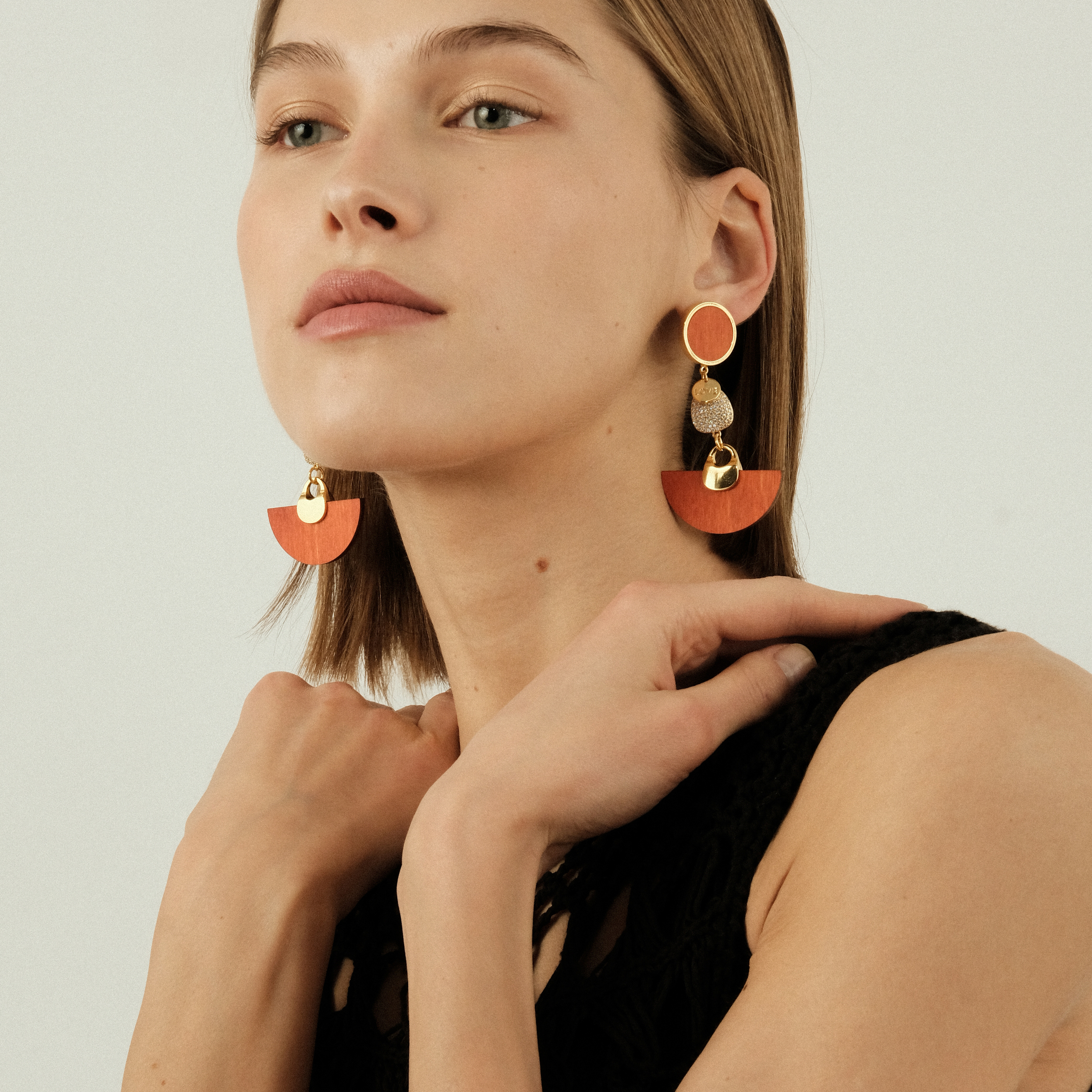 earrings with orange wooden inserts and crystals