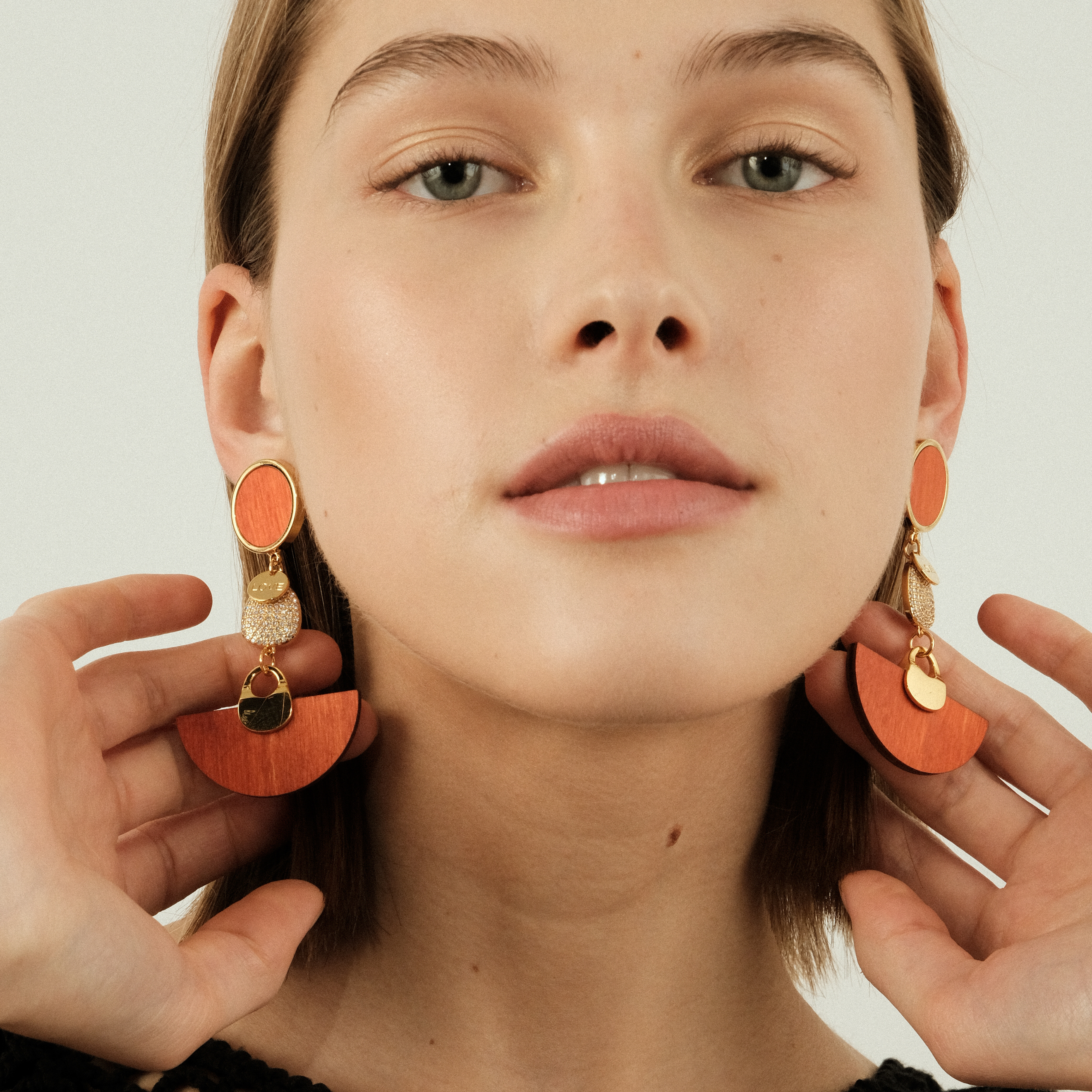 earrings with orange wooden inserts and crystals