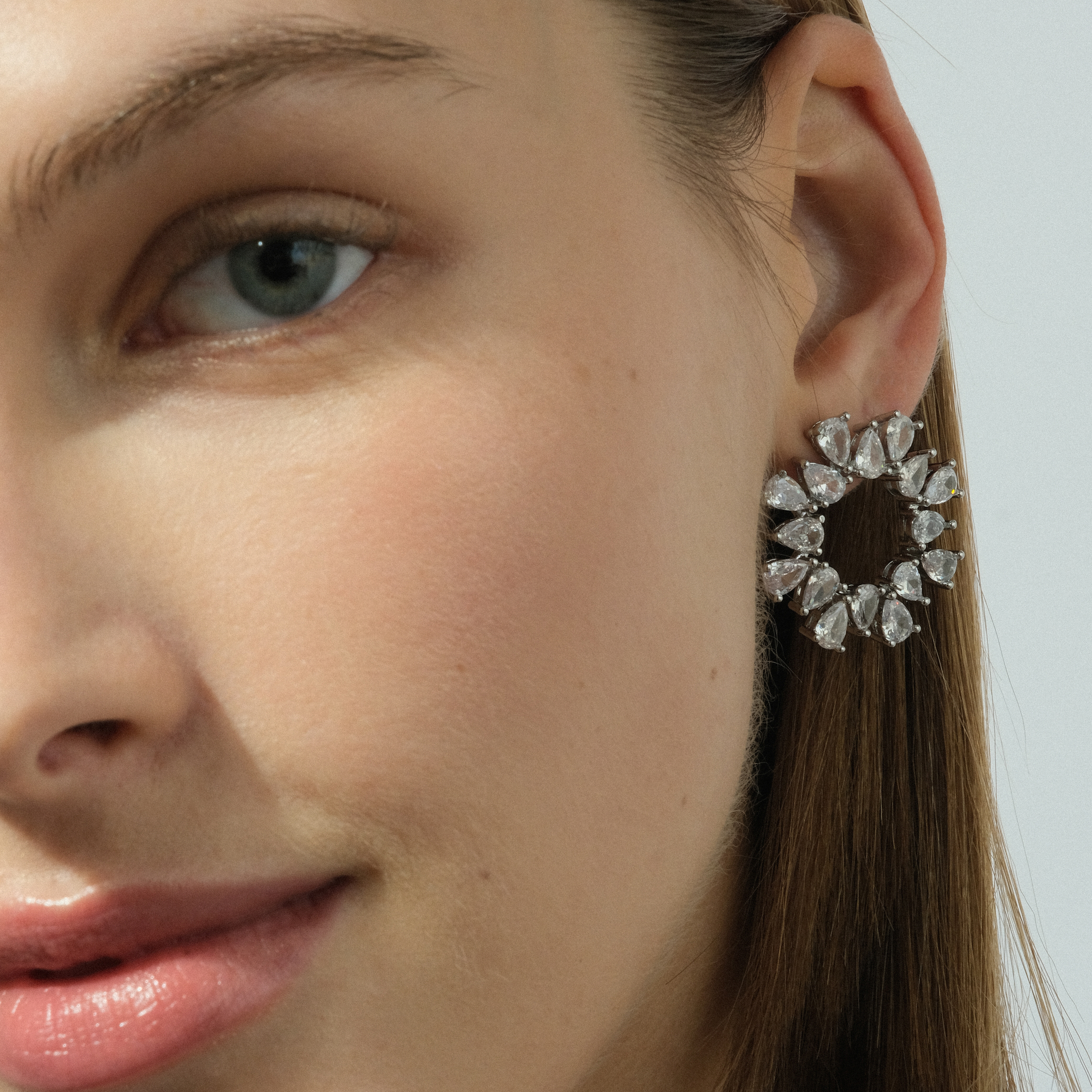 round earrings with crystals