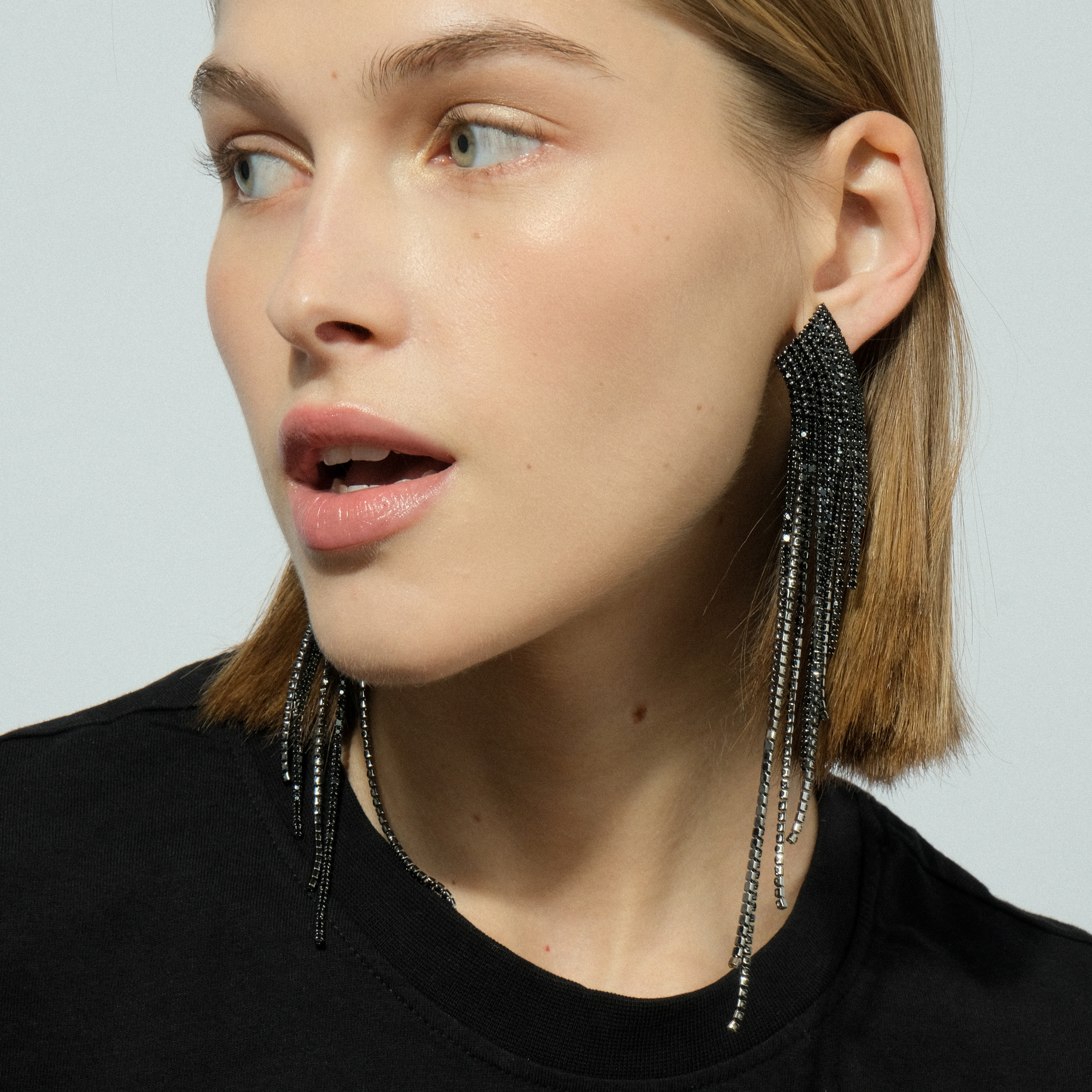 Black earrings completely covered with crystals