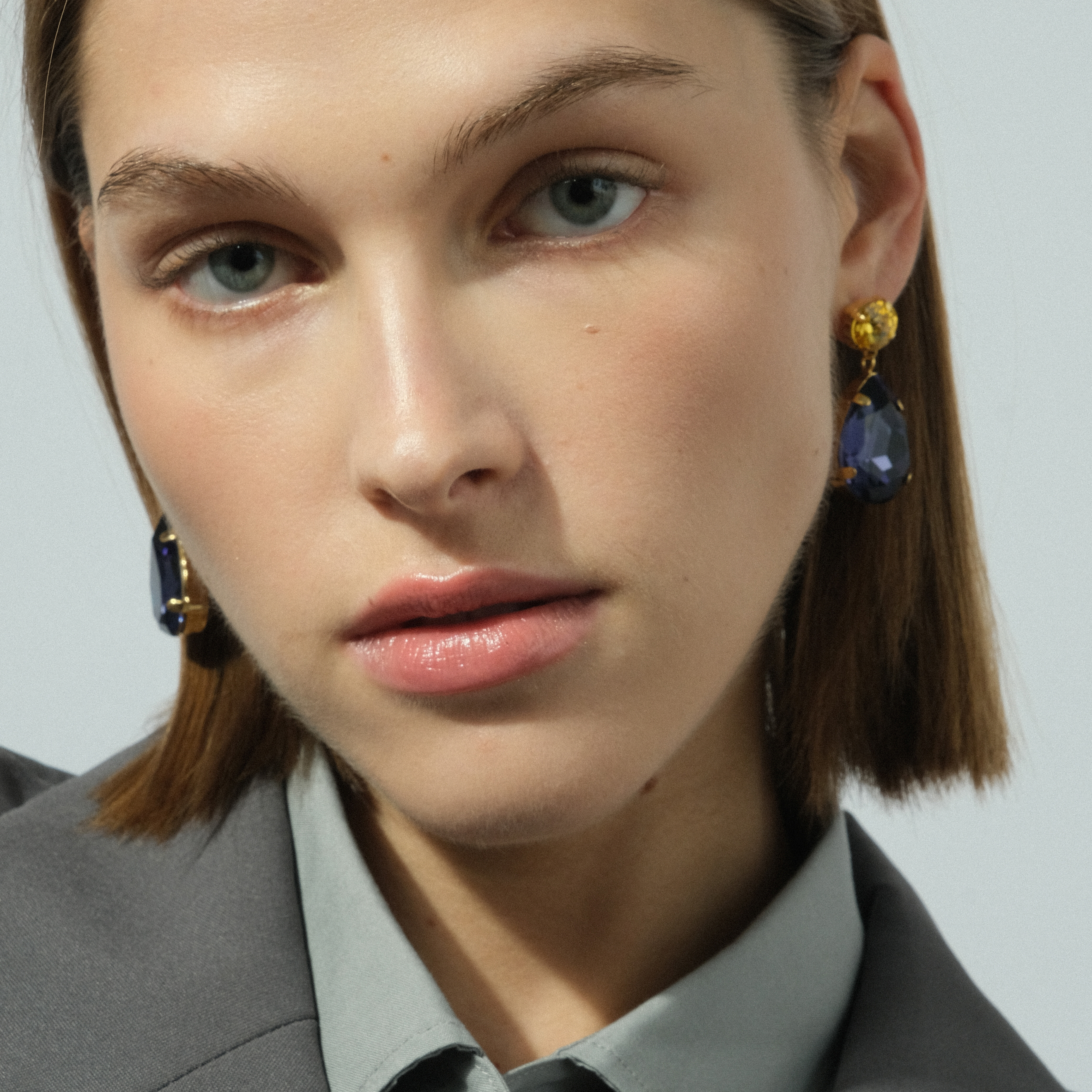 Earrings with large blue and yellow crystals