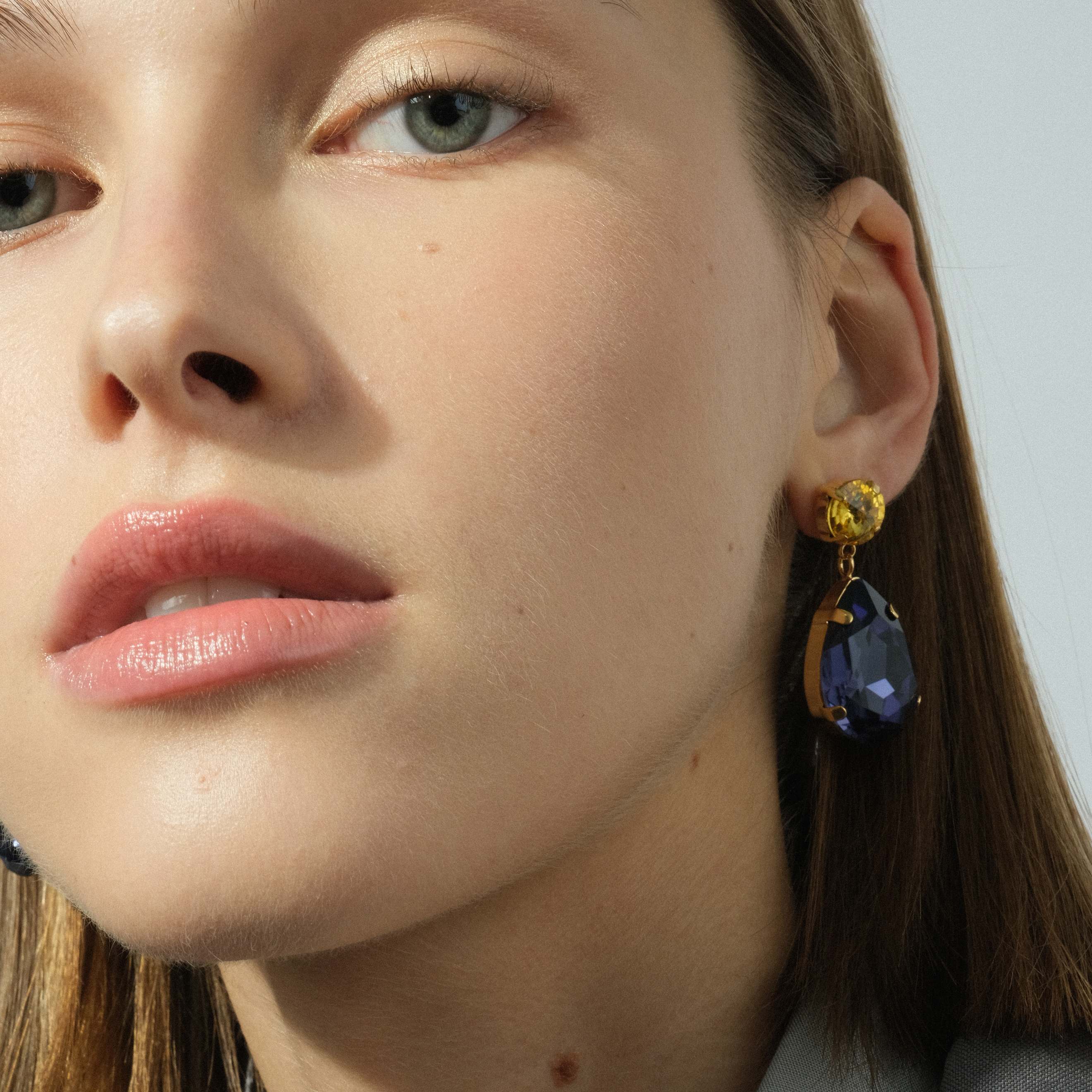 Earrings with large blue and yellow crystals