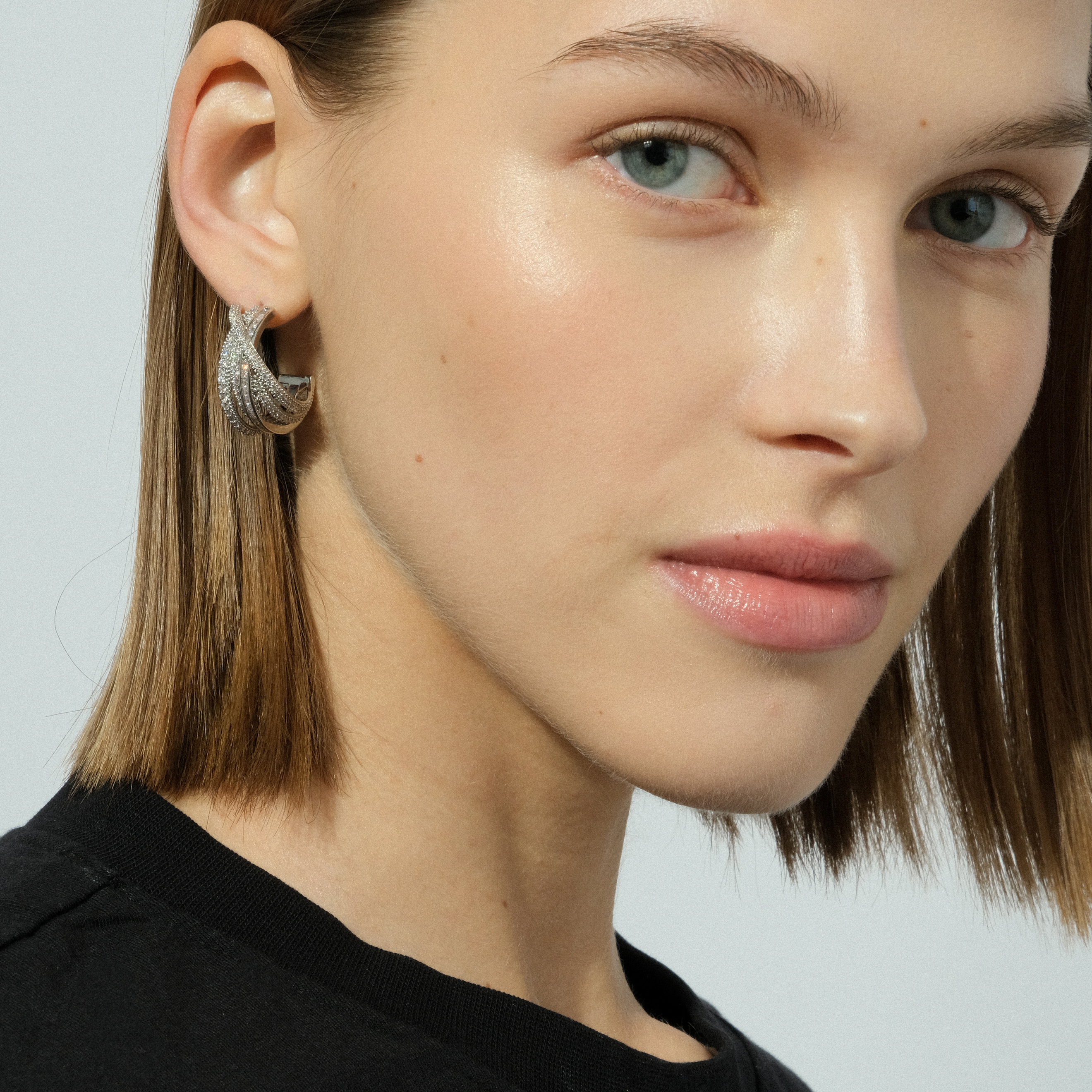 layered earrings with crystals