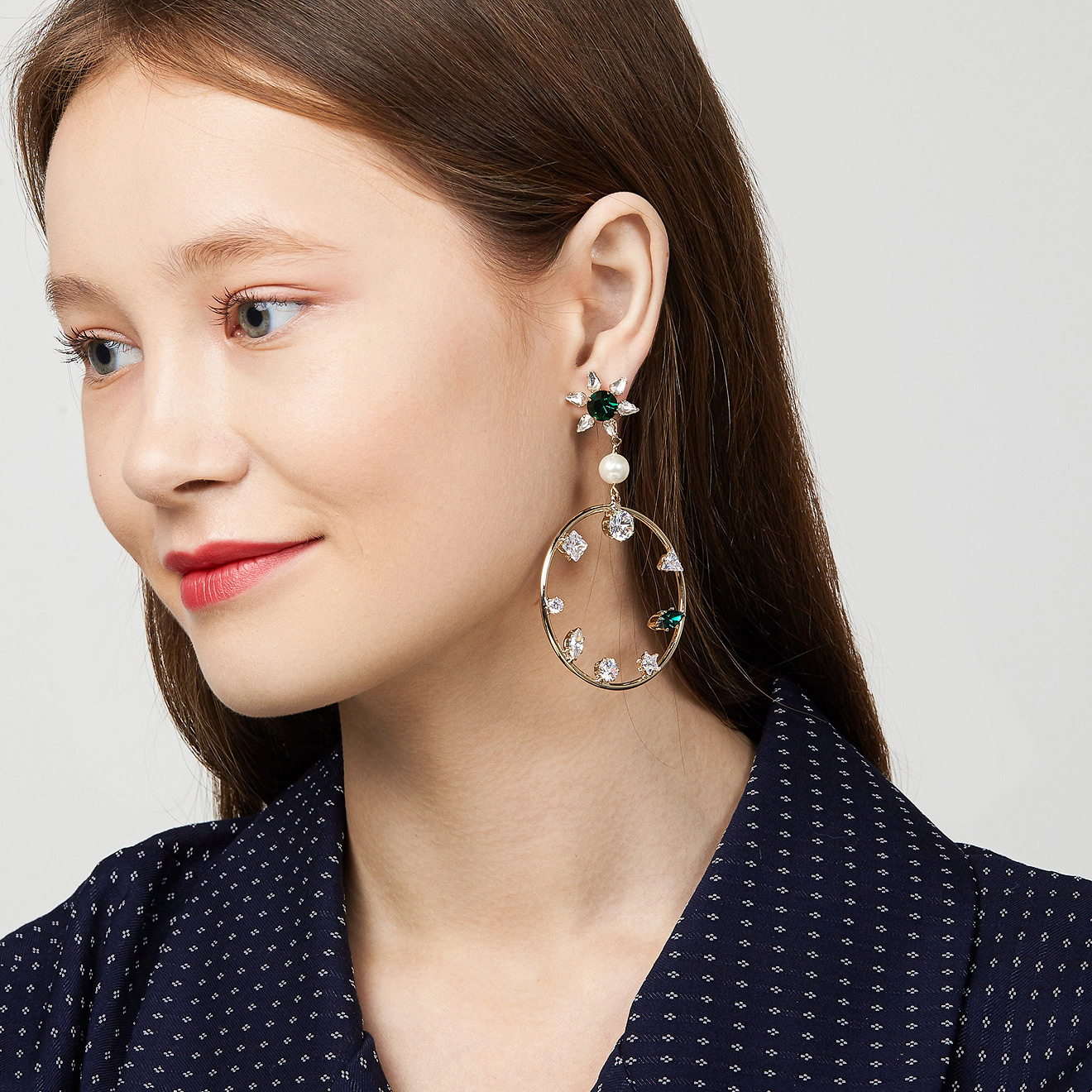 hoop earrings with white and green crystals