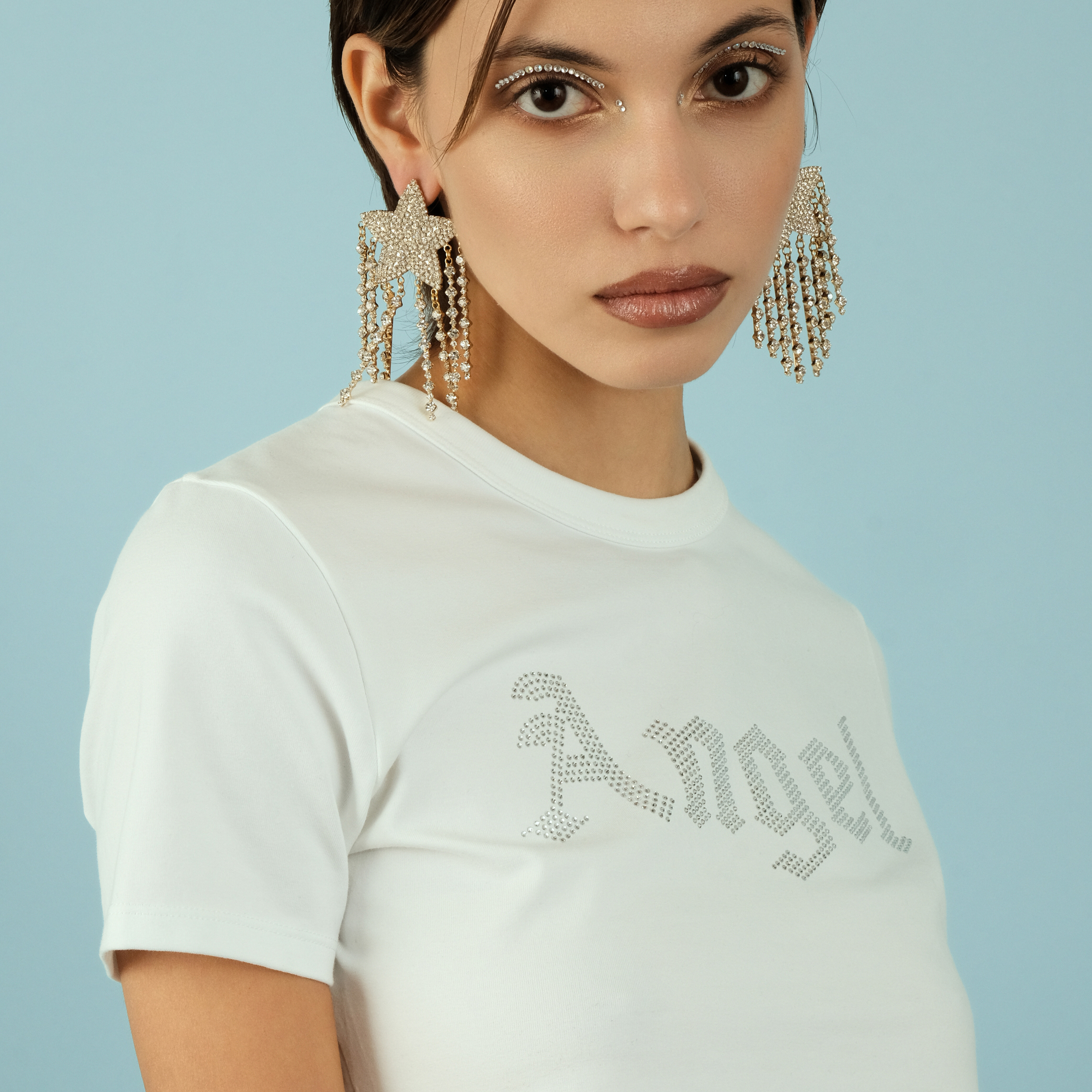 Large  star earrings, completely covered with crystals, with suspensions-threads