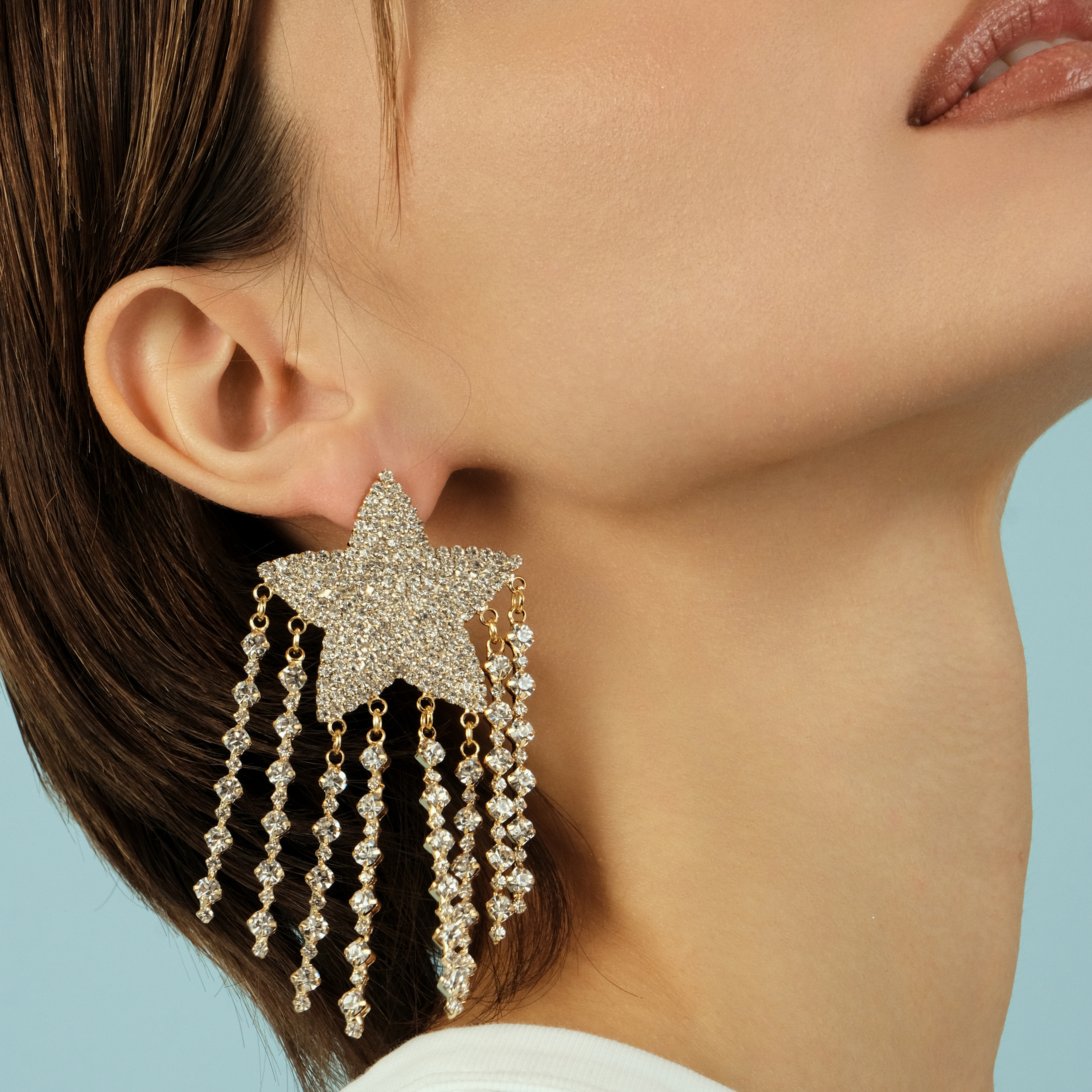 Large  star earrings, completely covered with crystals, with suspensions-threads