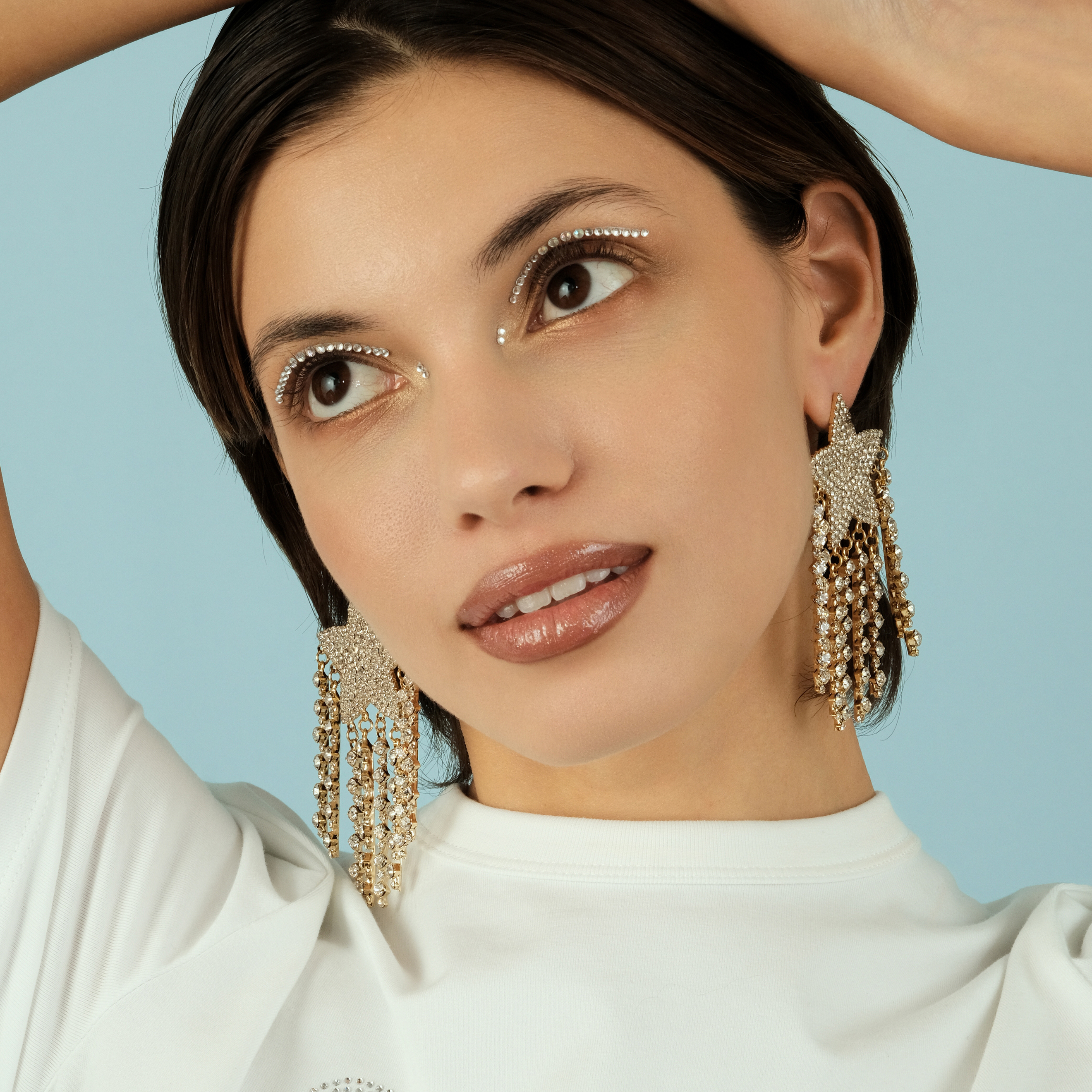 Large  star earrings, completely covered with crystals, with suspensions-threads