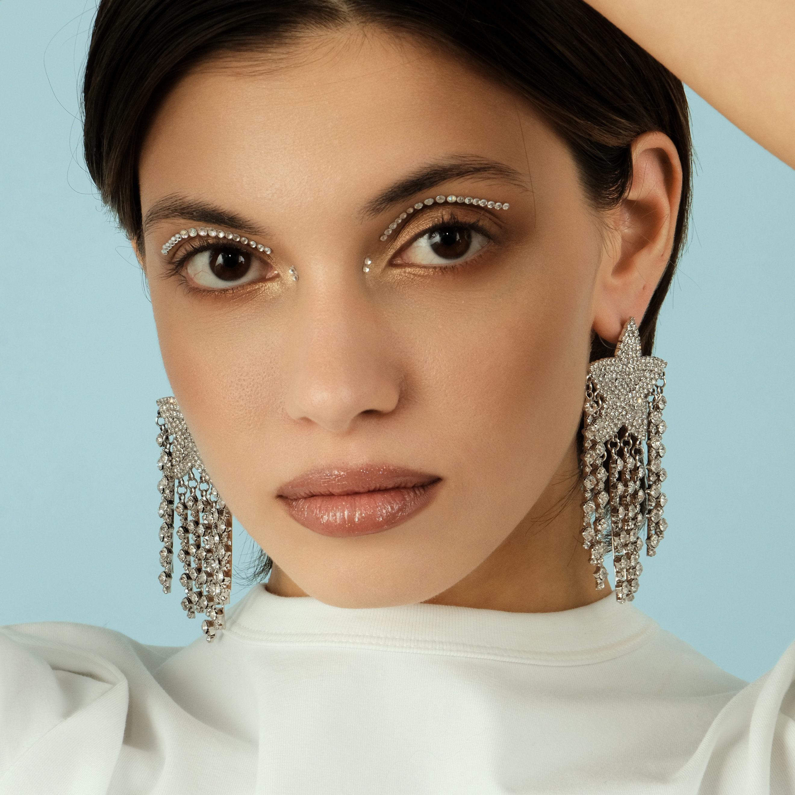 Large  star earrings, completelcovered with crystals, with thread pendants