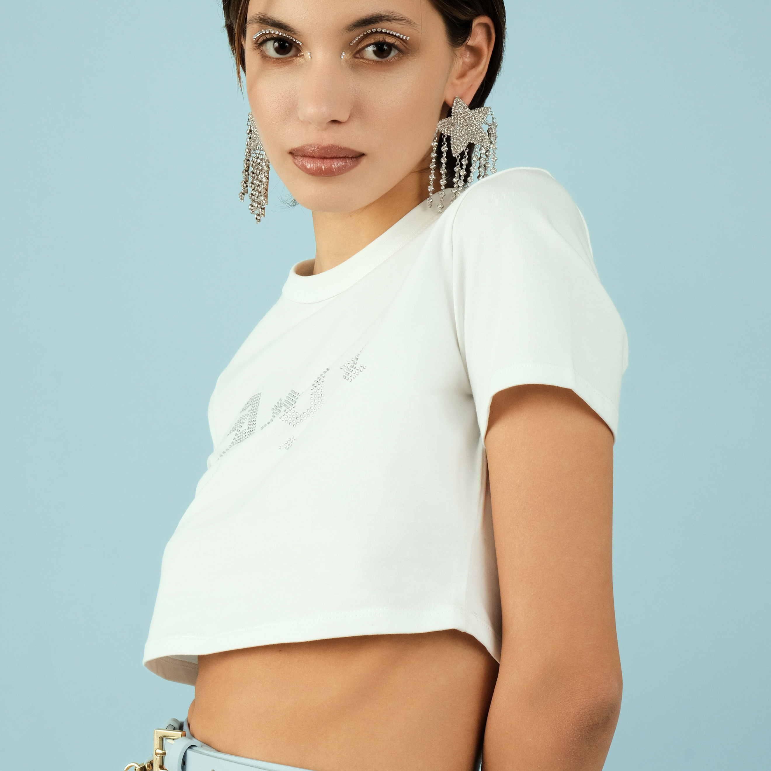 Large  star earrings, completelcovered with crystals, with thread pendants