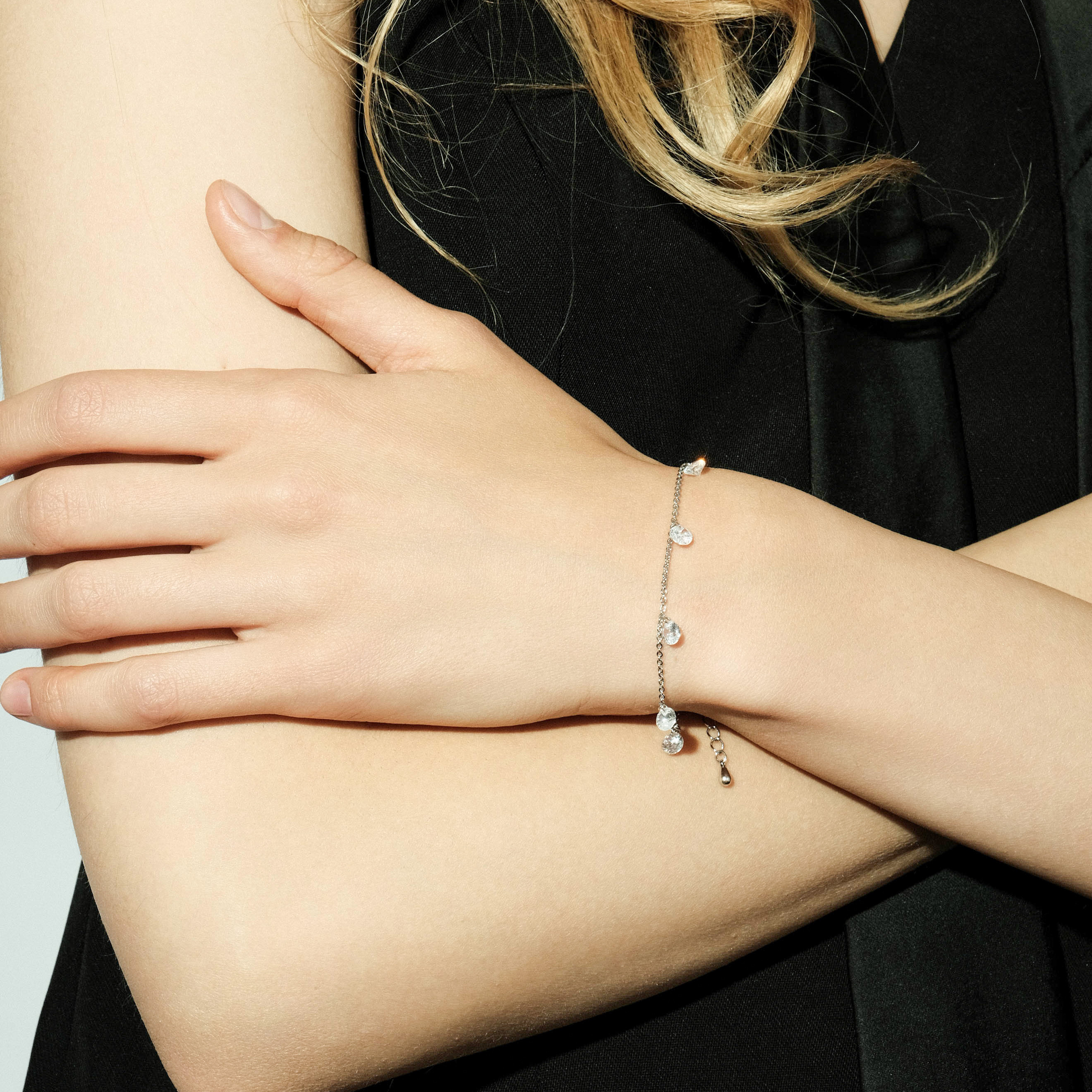 Silver bracelet with crystal pendants