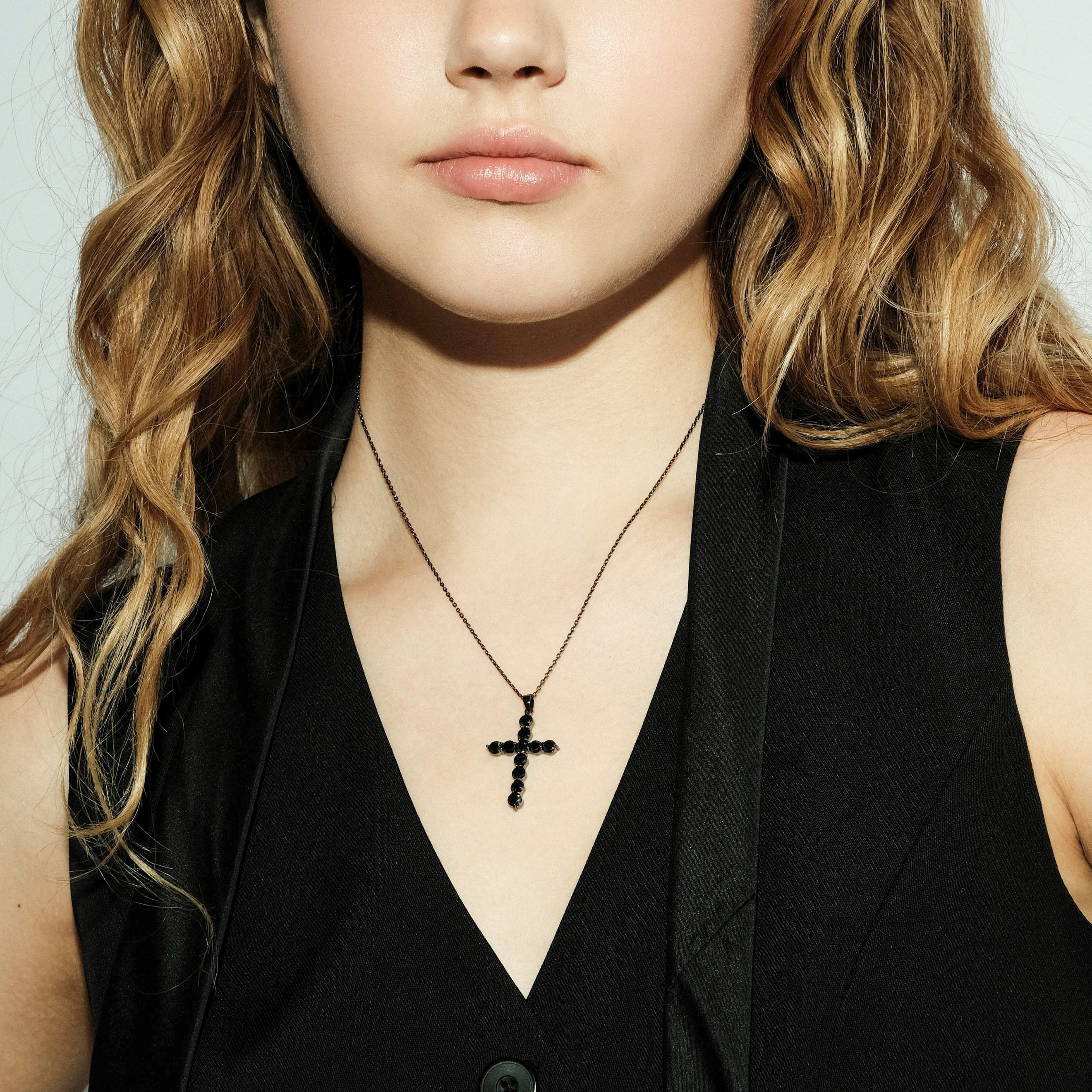 Black necklace with a cross pendant with black crystals