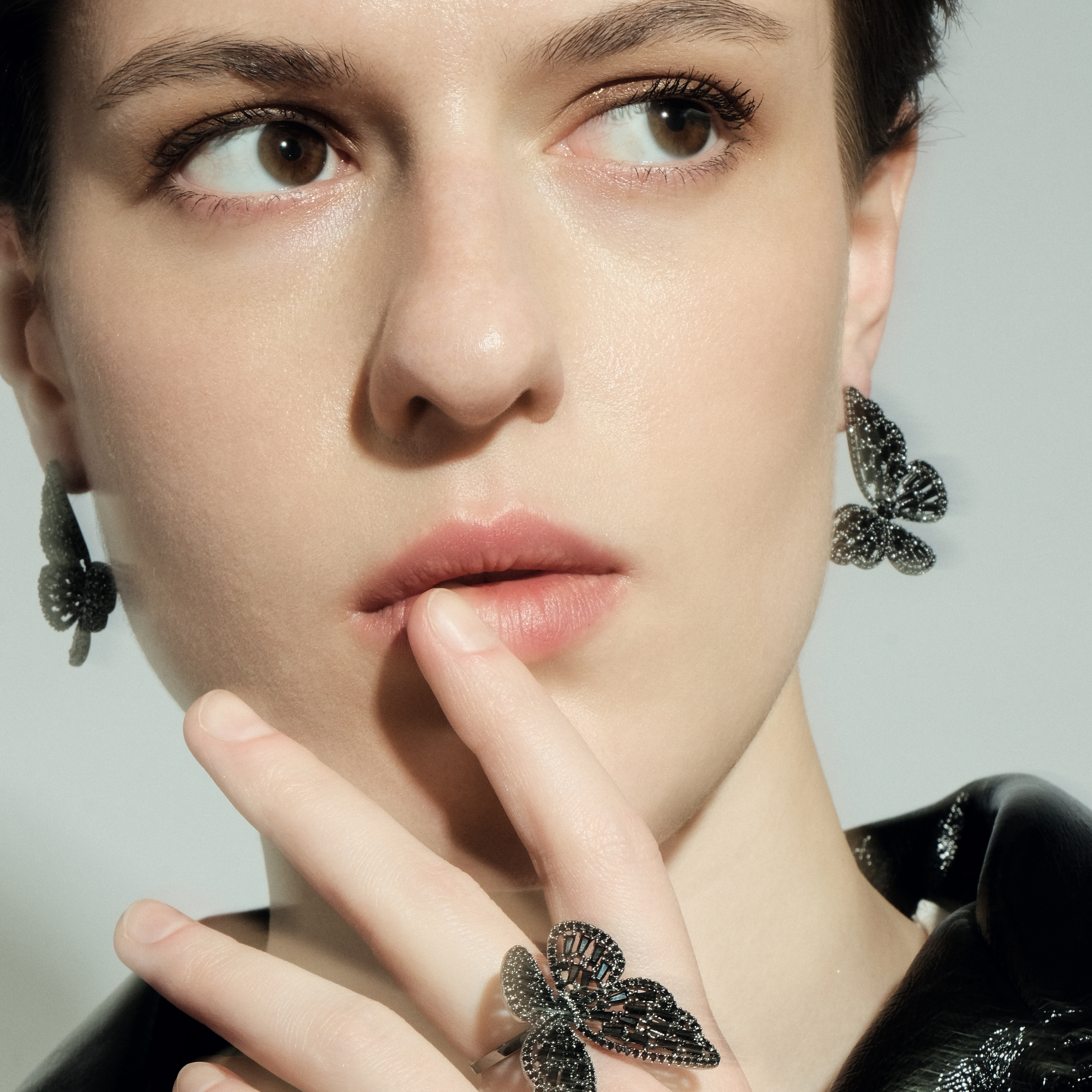 Blackened butterfly ring with crystals
