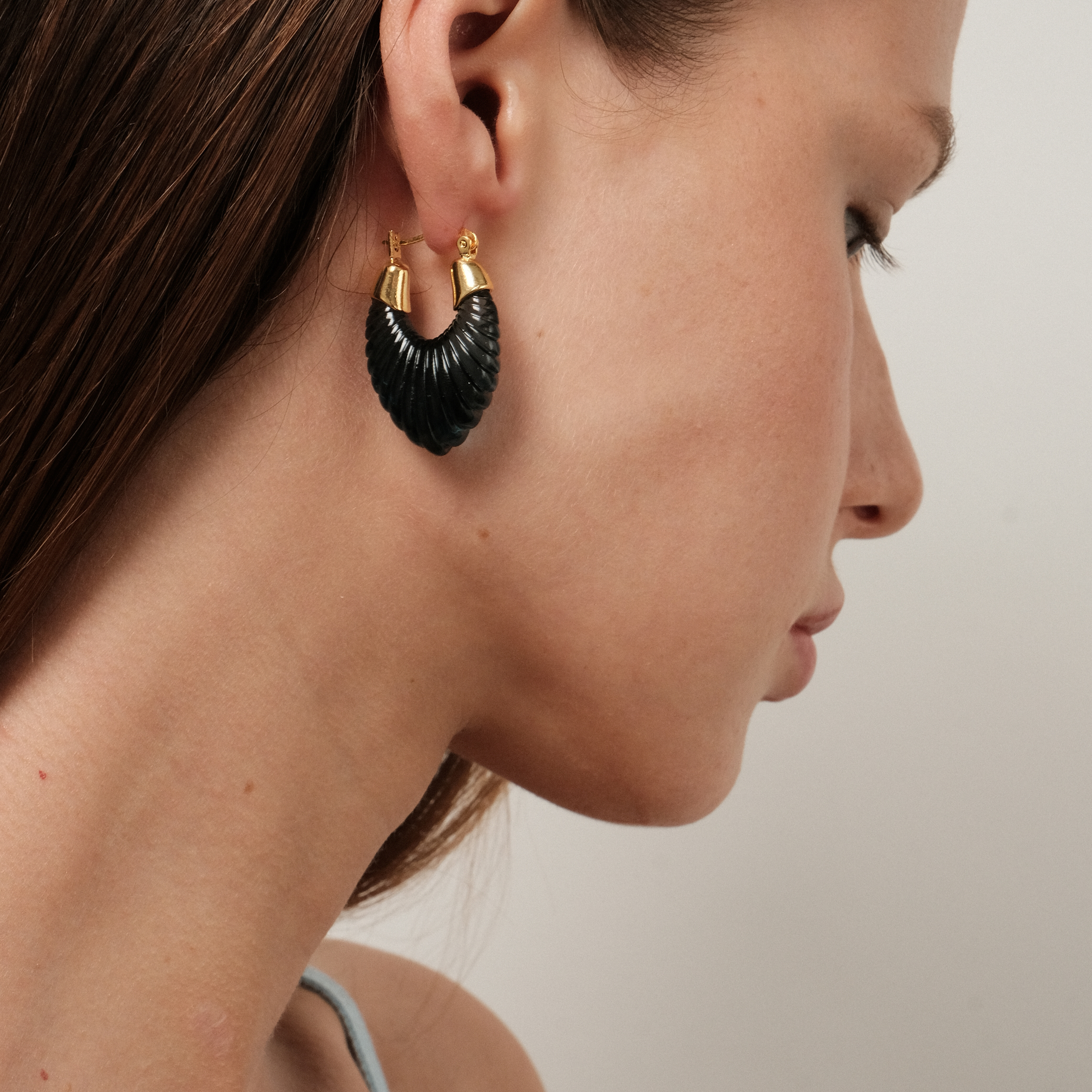 earrings with a curly dark blue insert