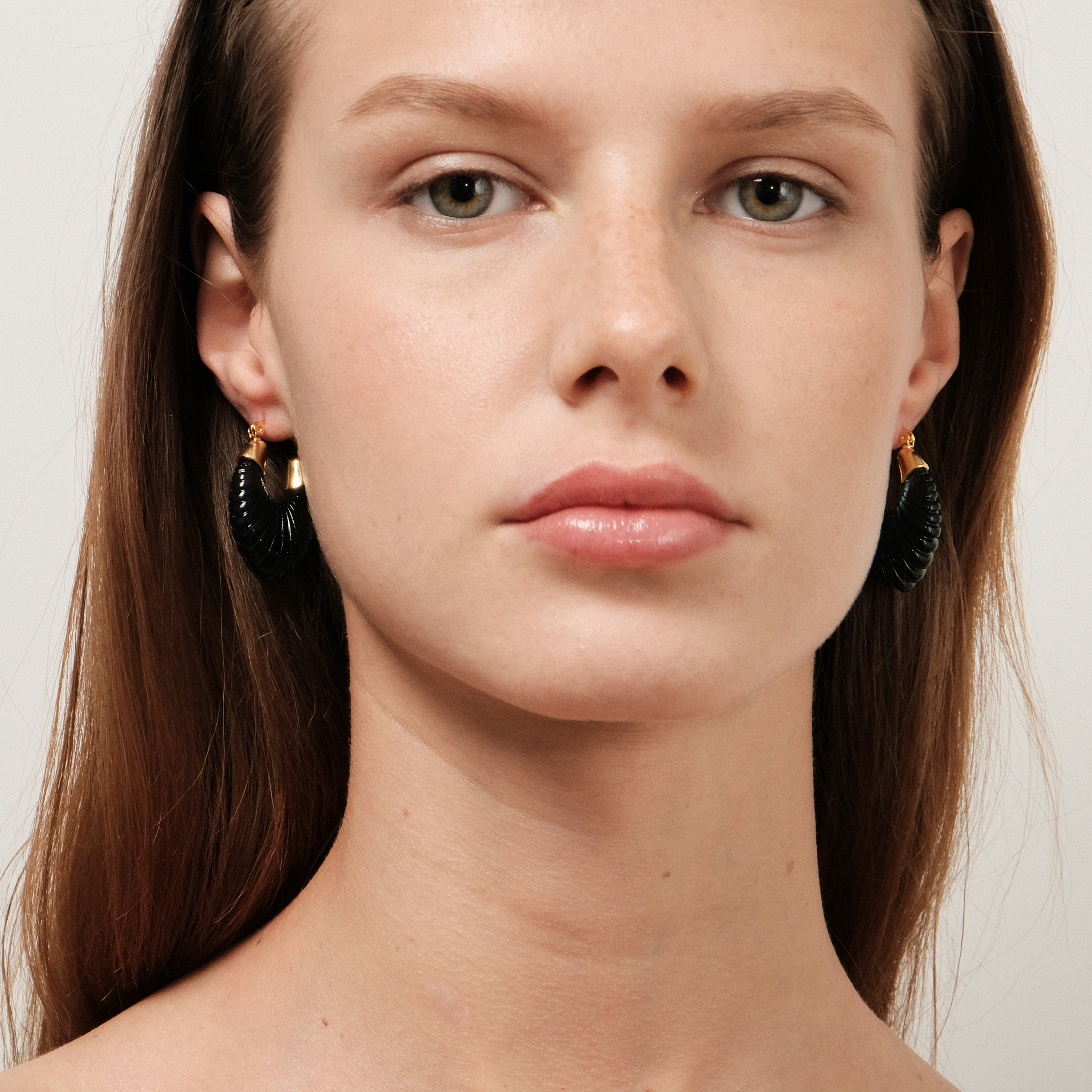 earrings with a curly dark blue insert