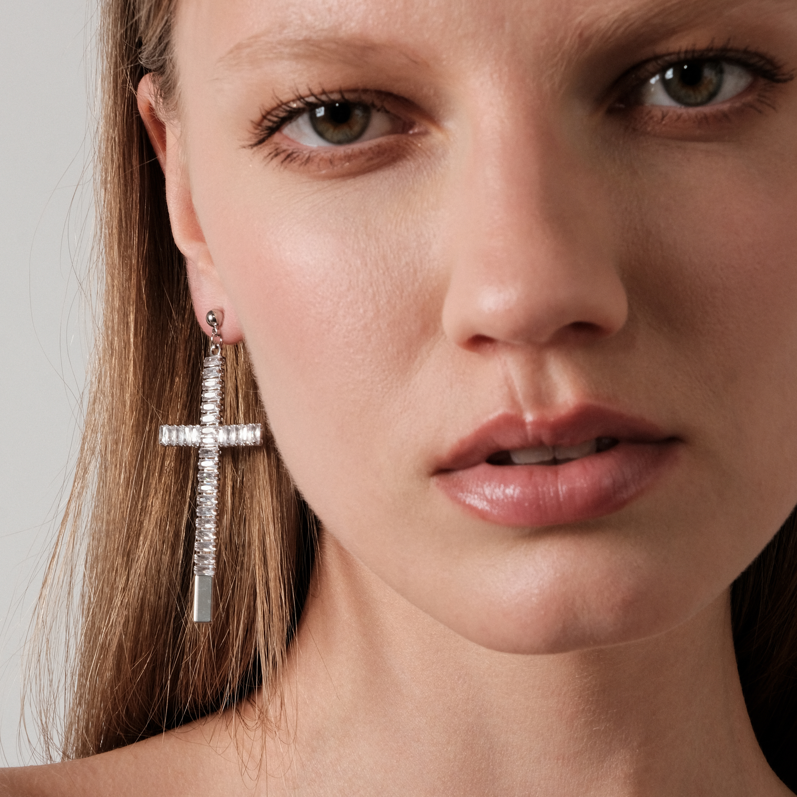 cross earrings covered with crystals
