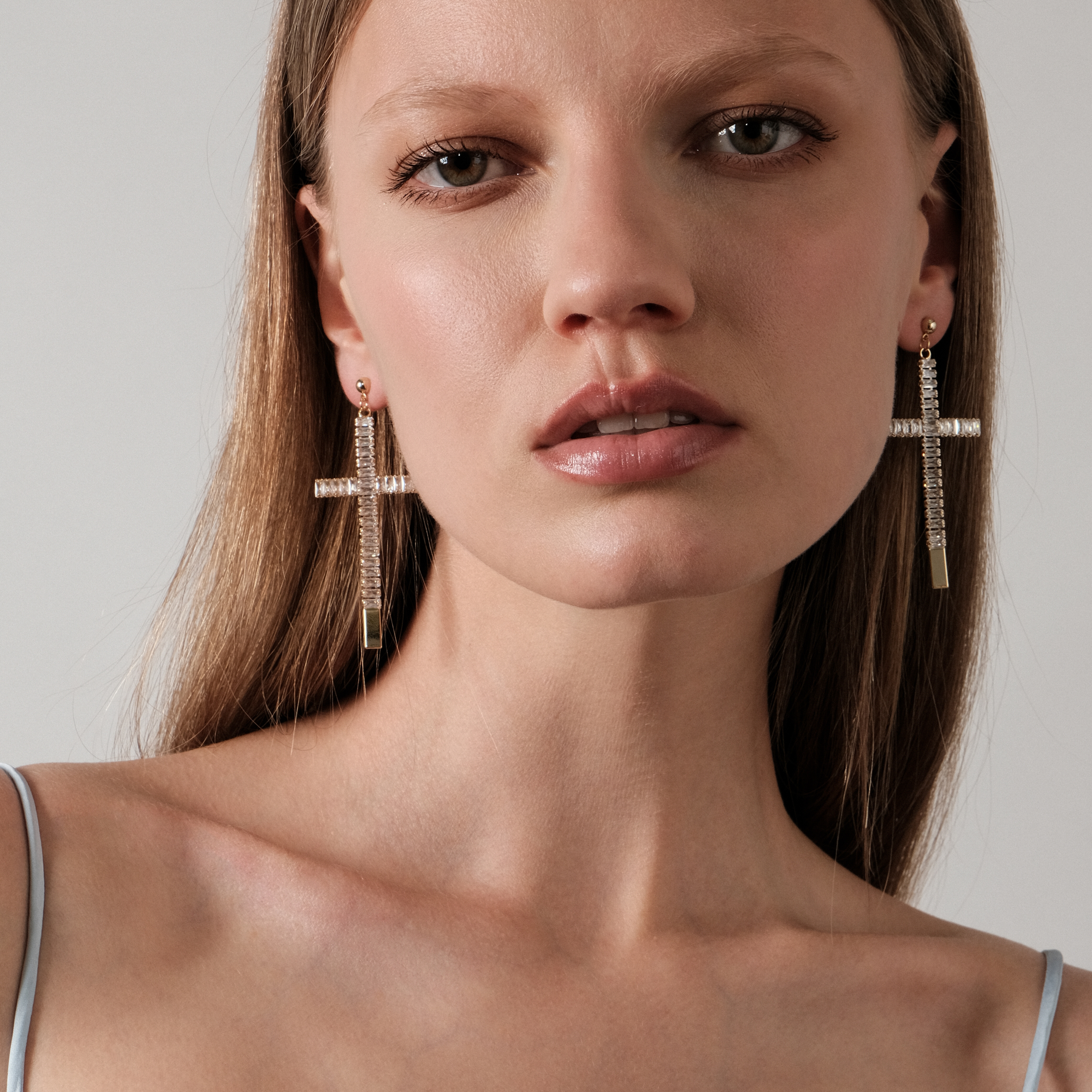 cross earrings completely covered with crystals