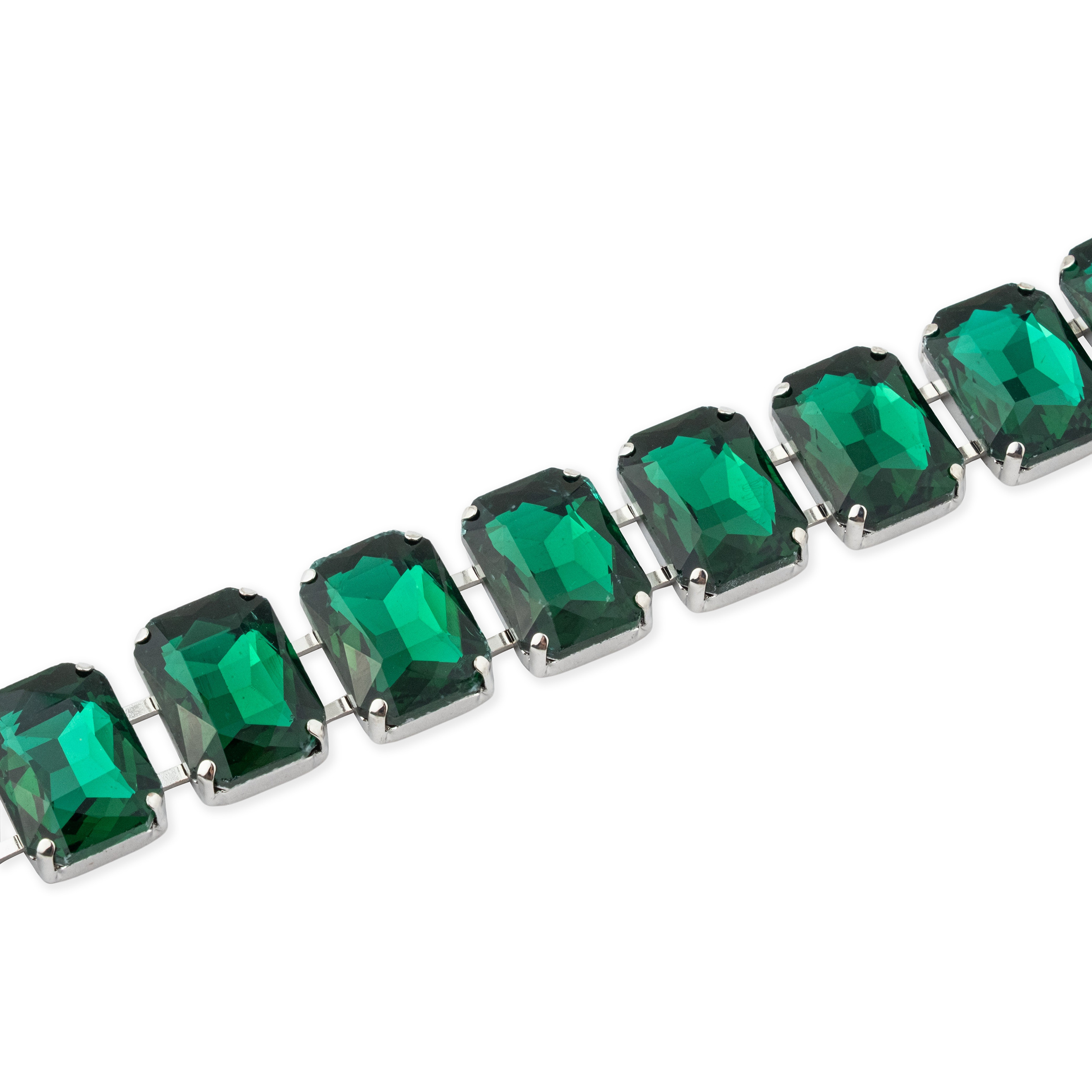 Silver bracelet with large green crystals