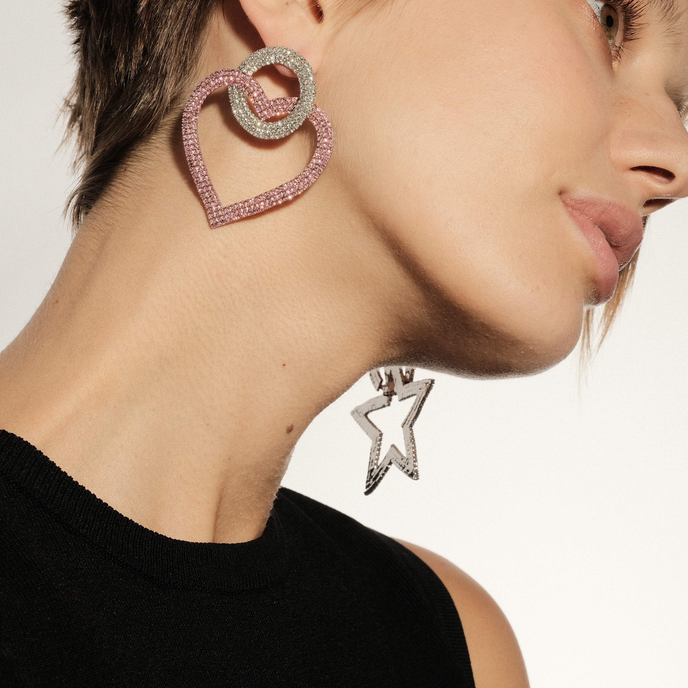 earrings with pink hearts completelcovered with crystals