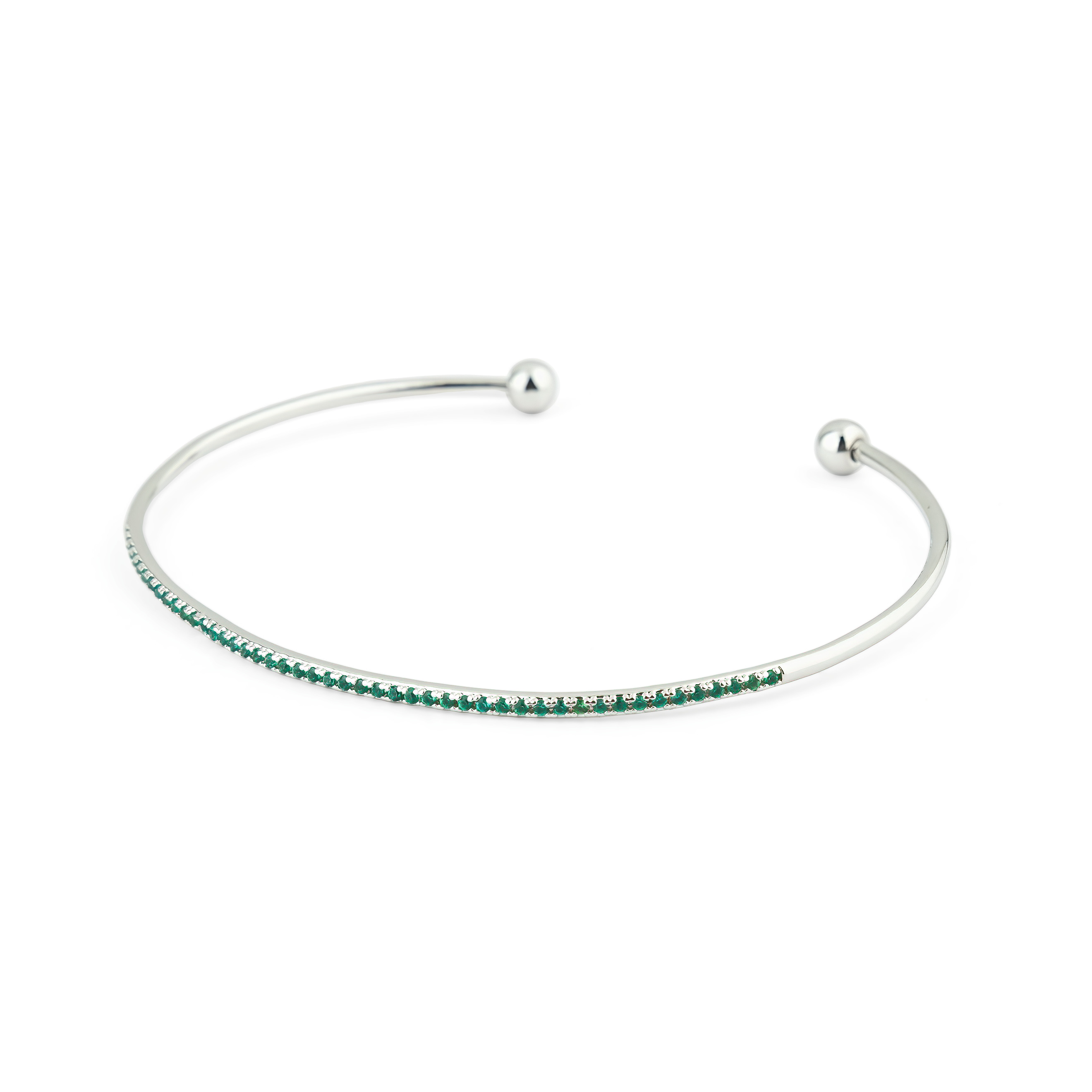 thin silver-tone bracelet with green crystals