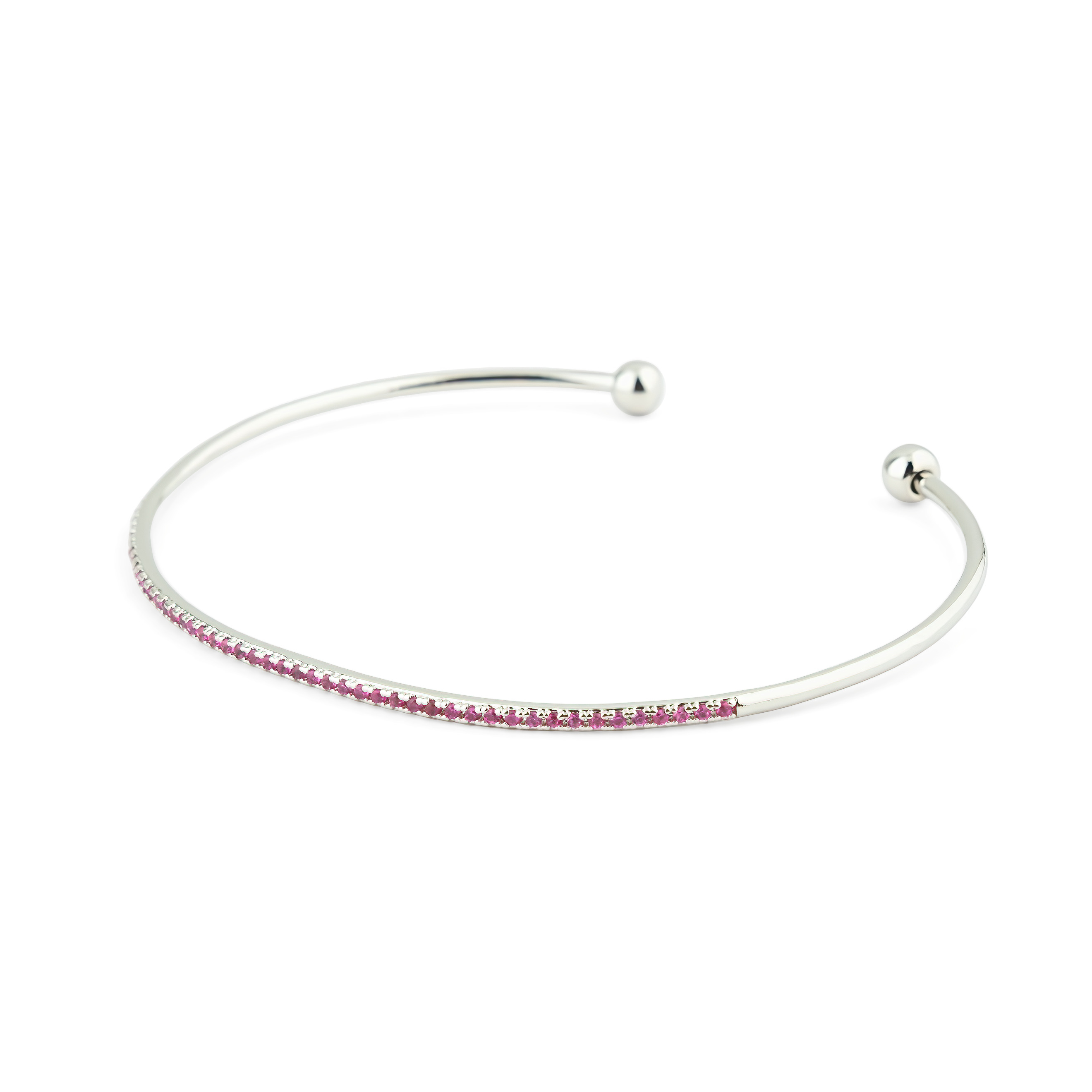 thin silver-tone bracelet with pink crystals