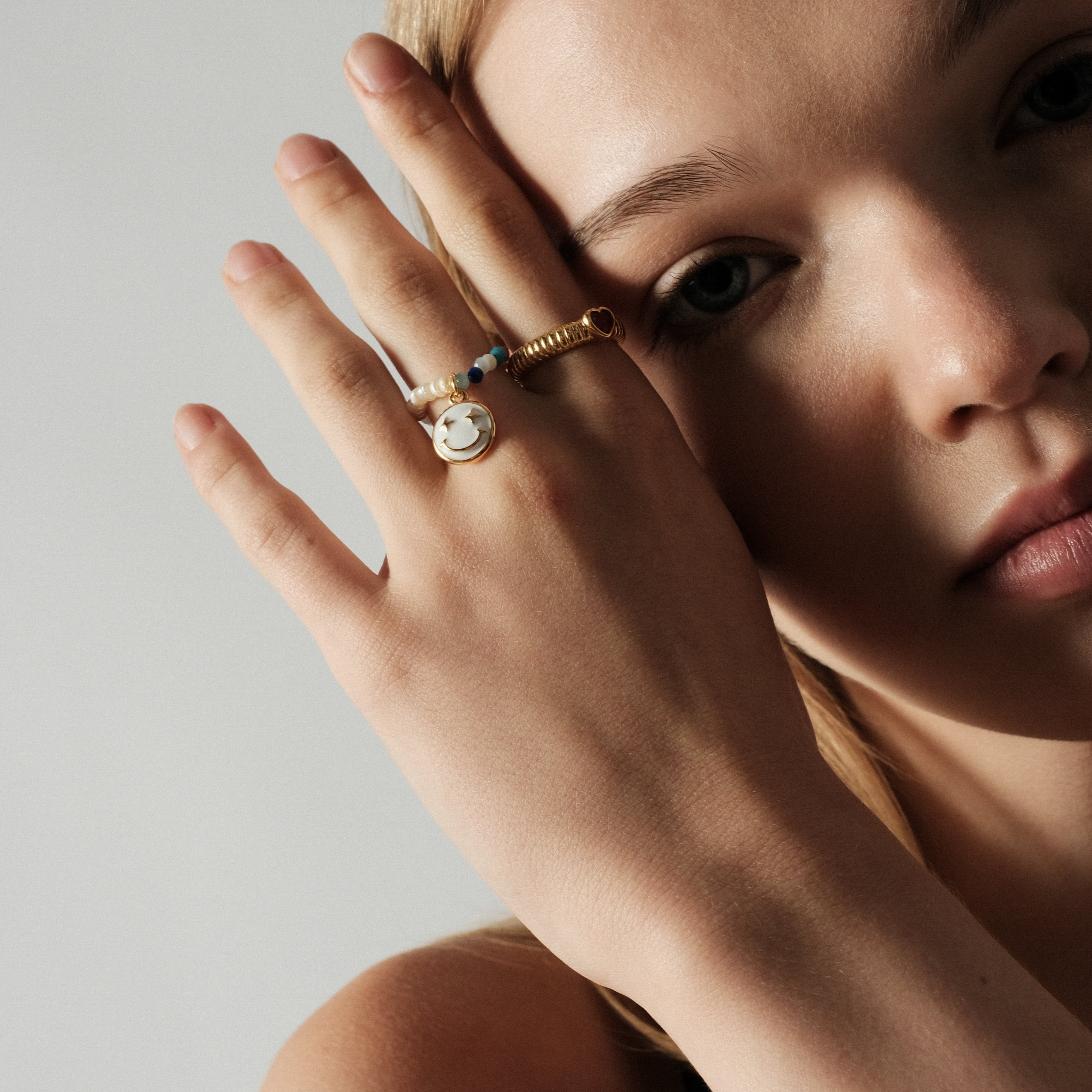 Сurly ring with a red heart