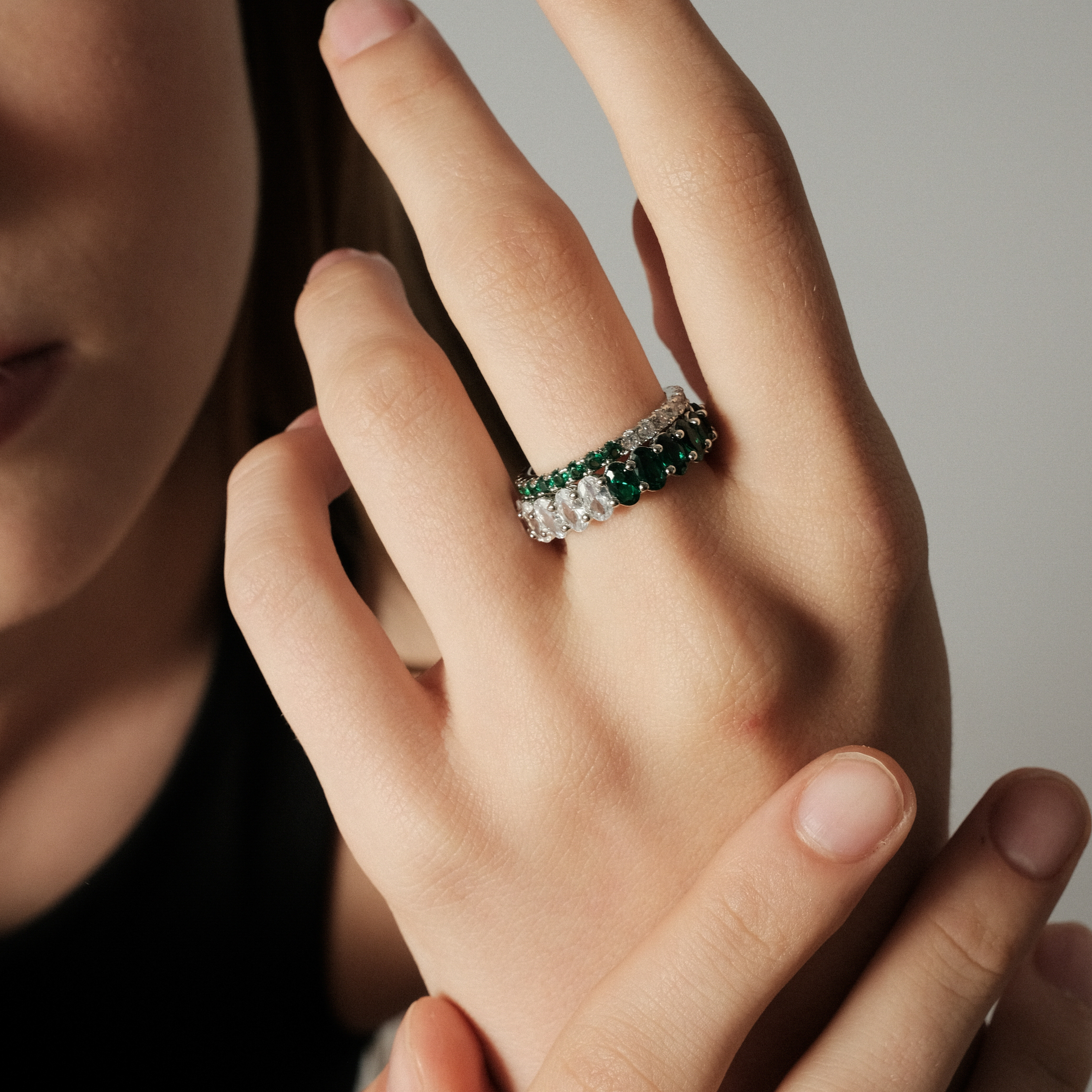 ring with ovals of white and green crystals