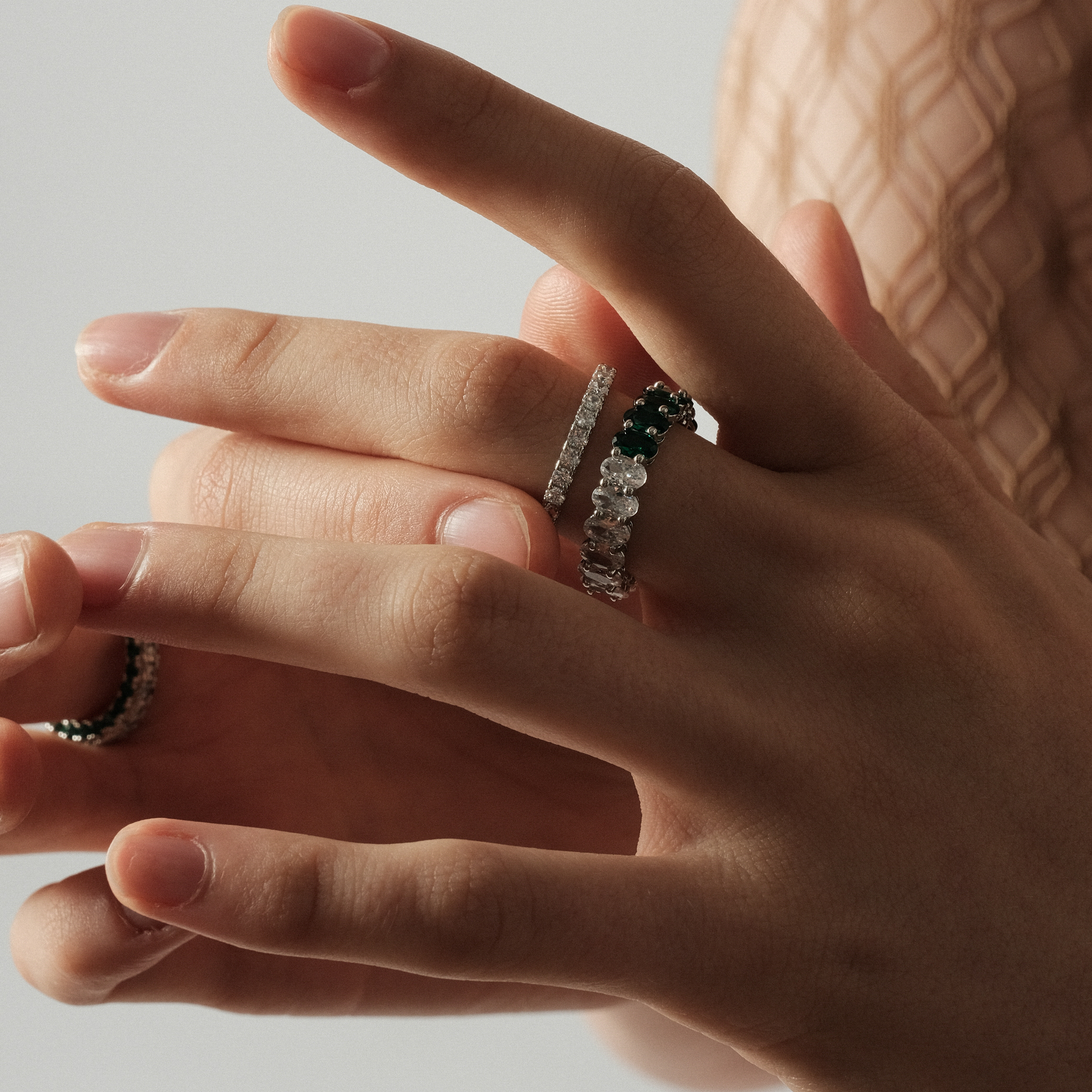 ring with ovals of white and green crystals