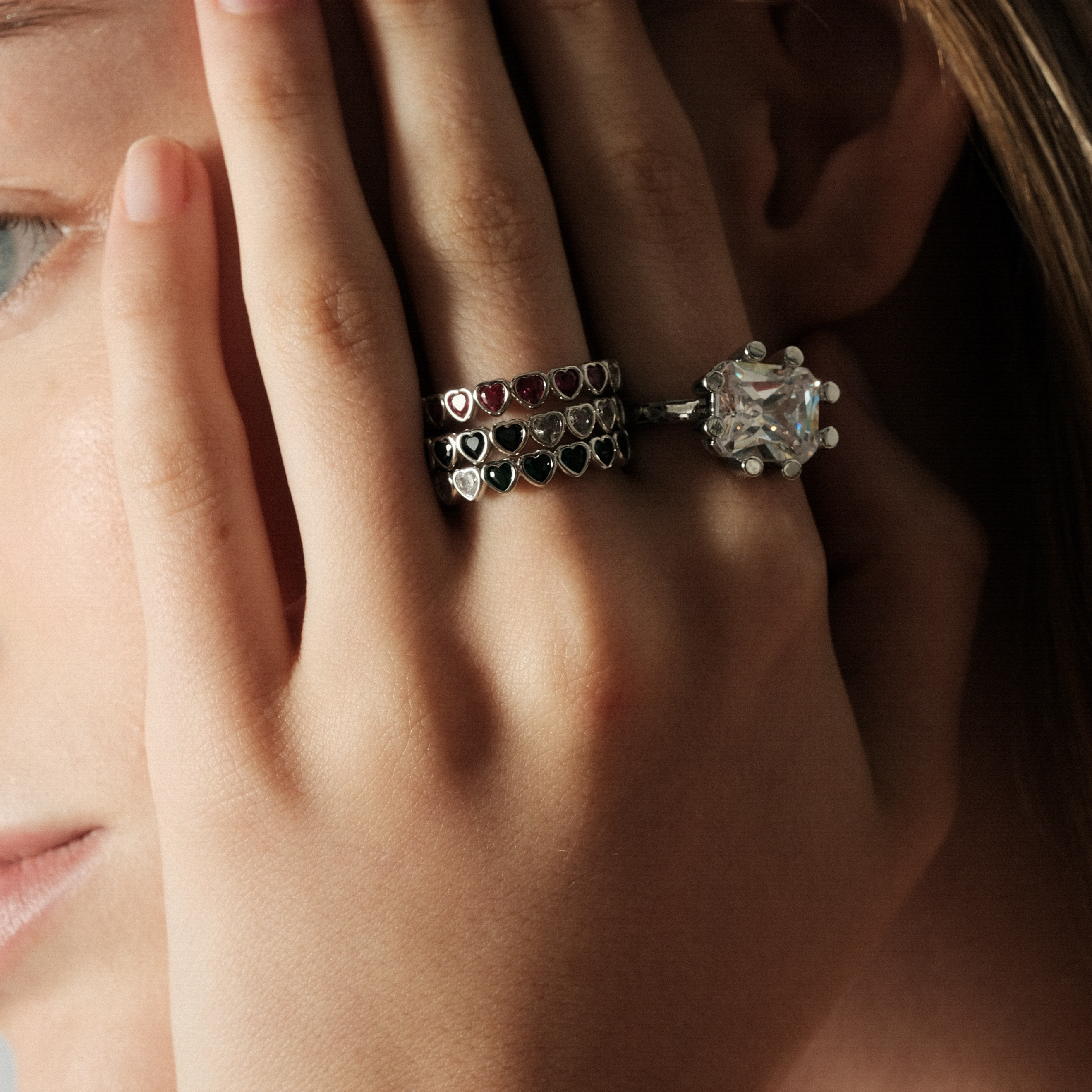 heart ring with white and green crystals