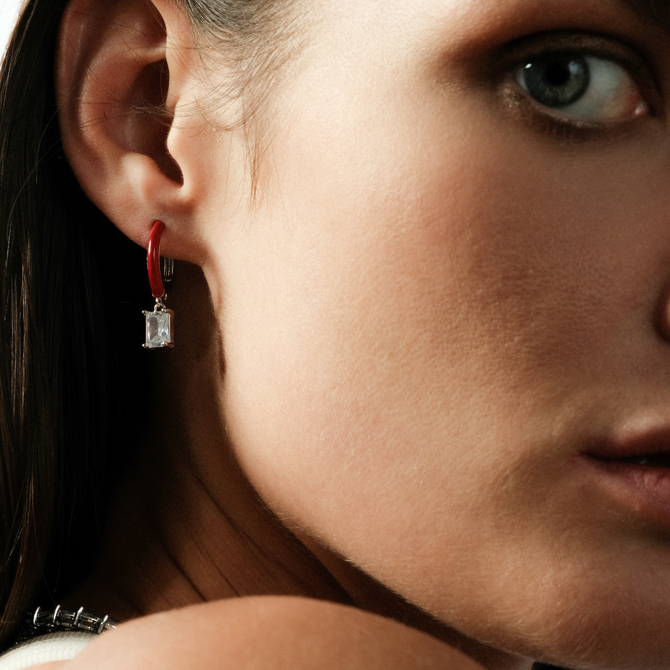 enamel earrings with a baguette cut pendant